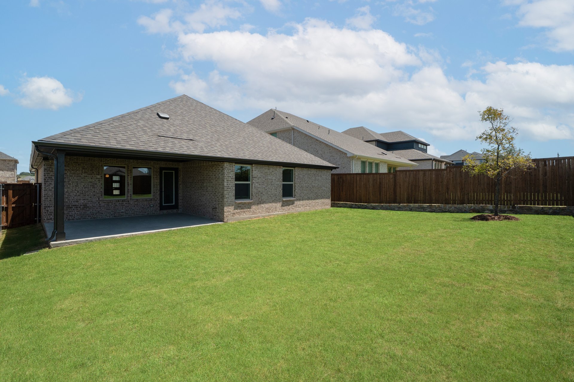backyard with grass and covered patio