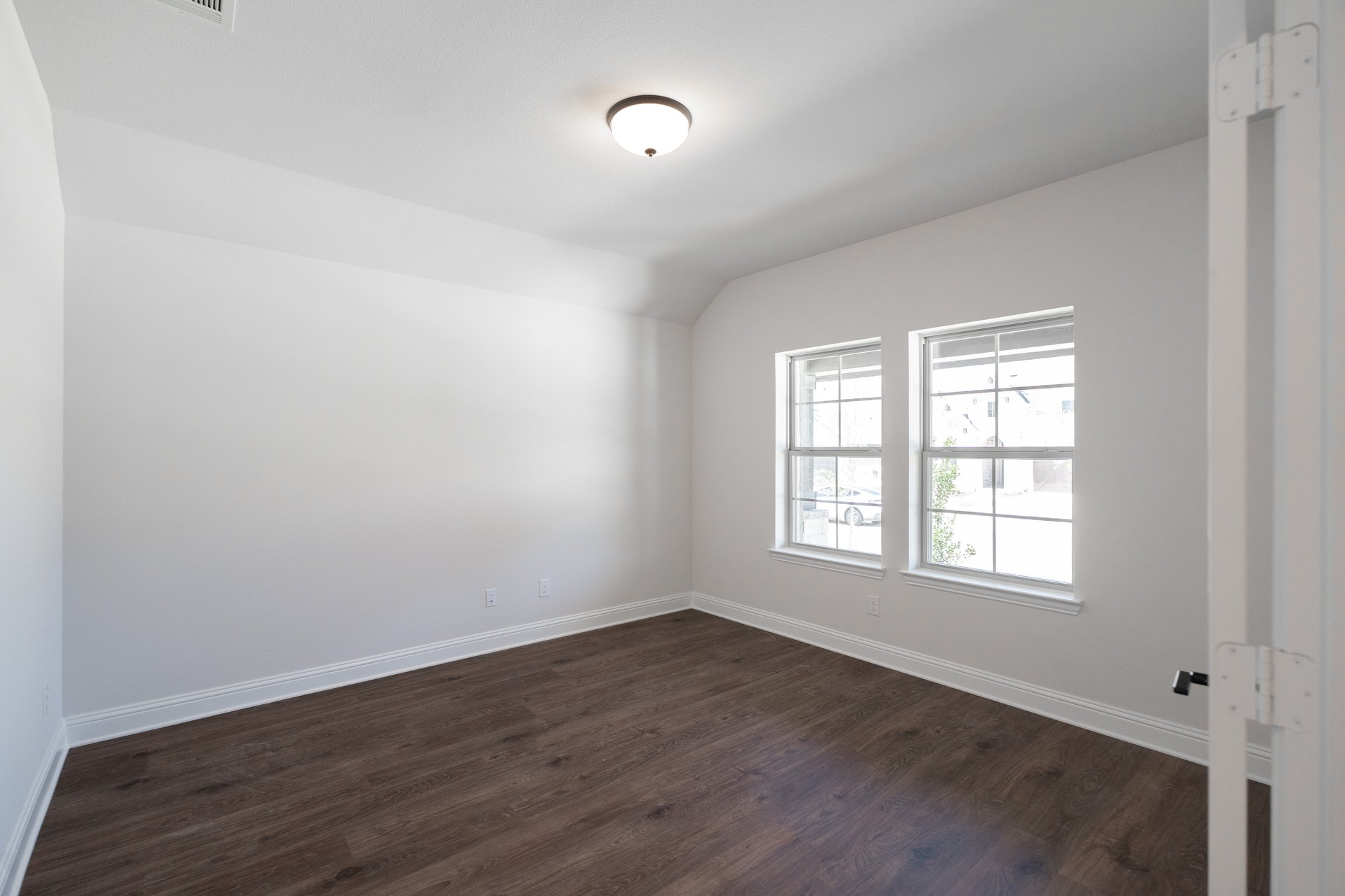private study with wood floors and french doors