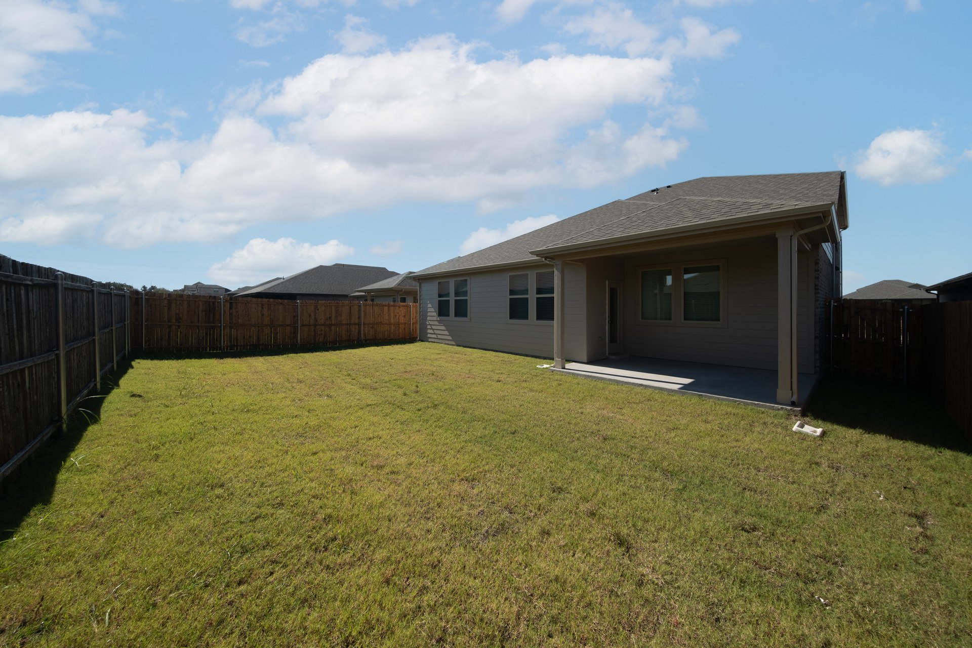 backyard of home with covered back patio