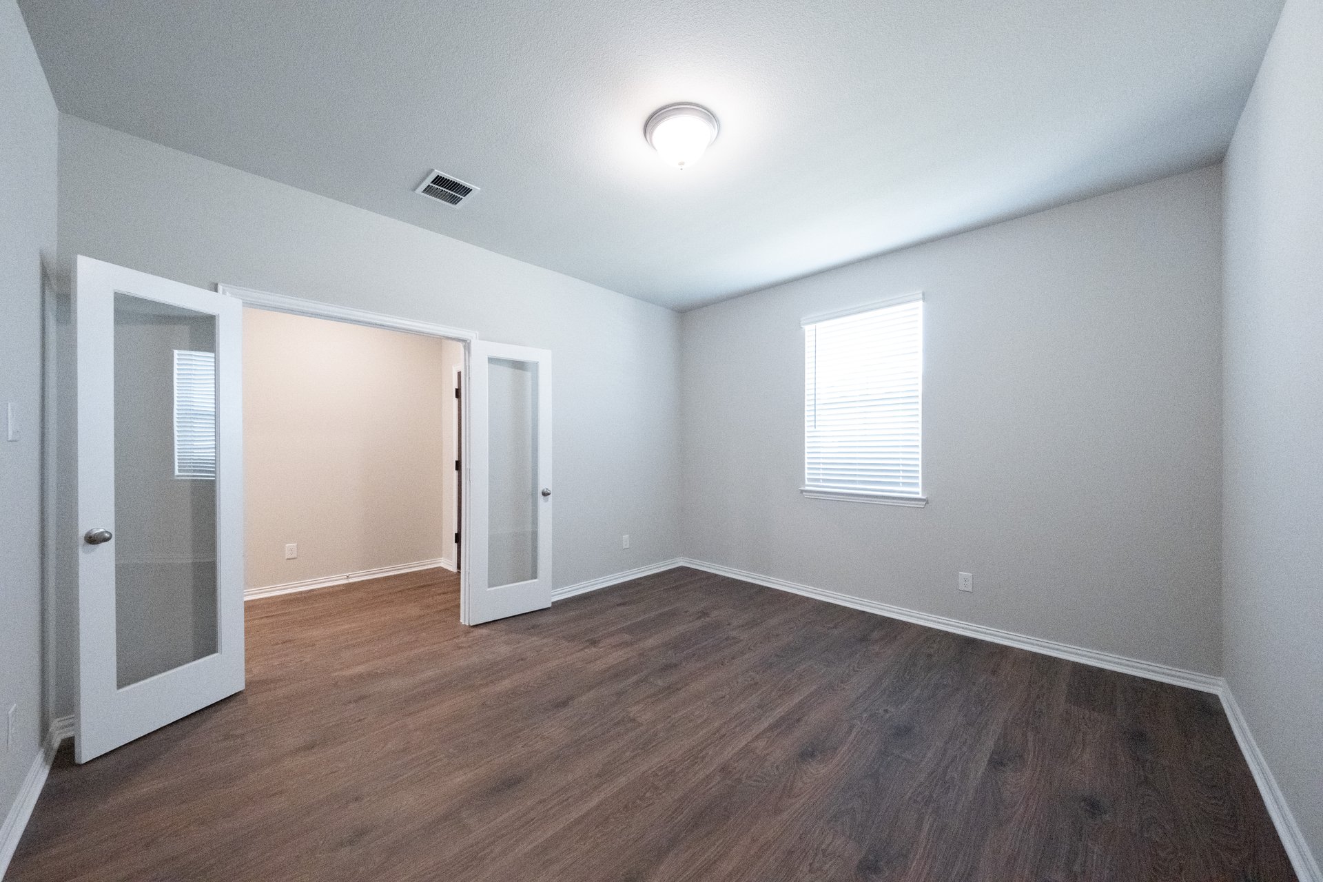 spacious study with hardwood flooring