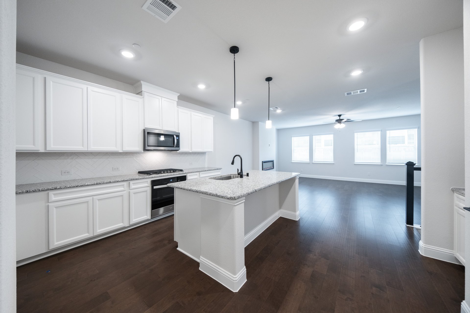 kitchen with large island and white cabinets