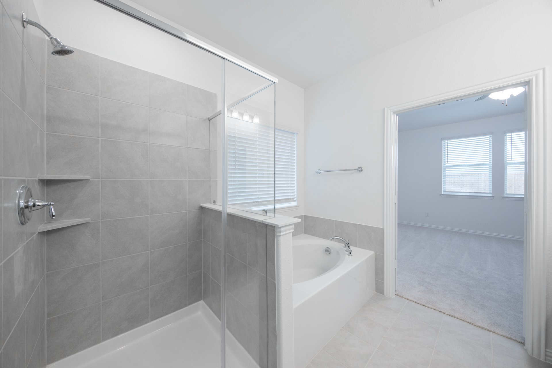 primary bathroom with soaking tub and walk-in shower