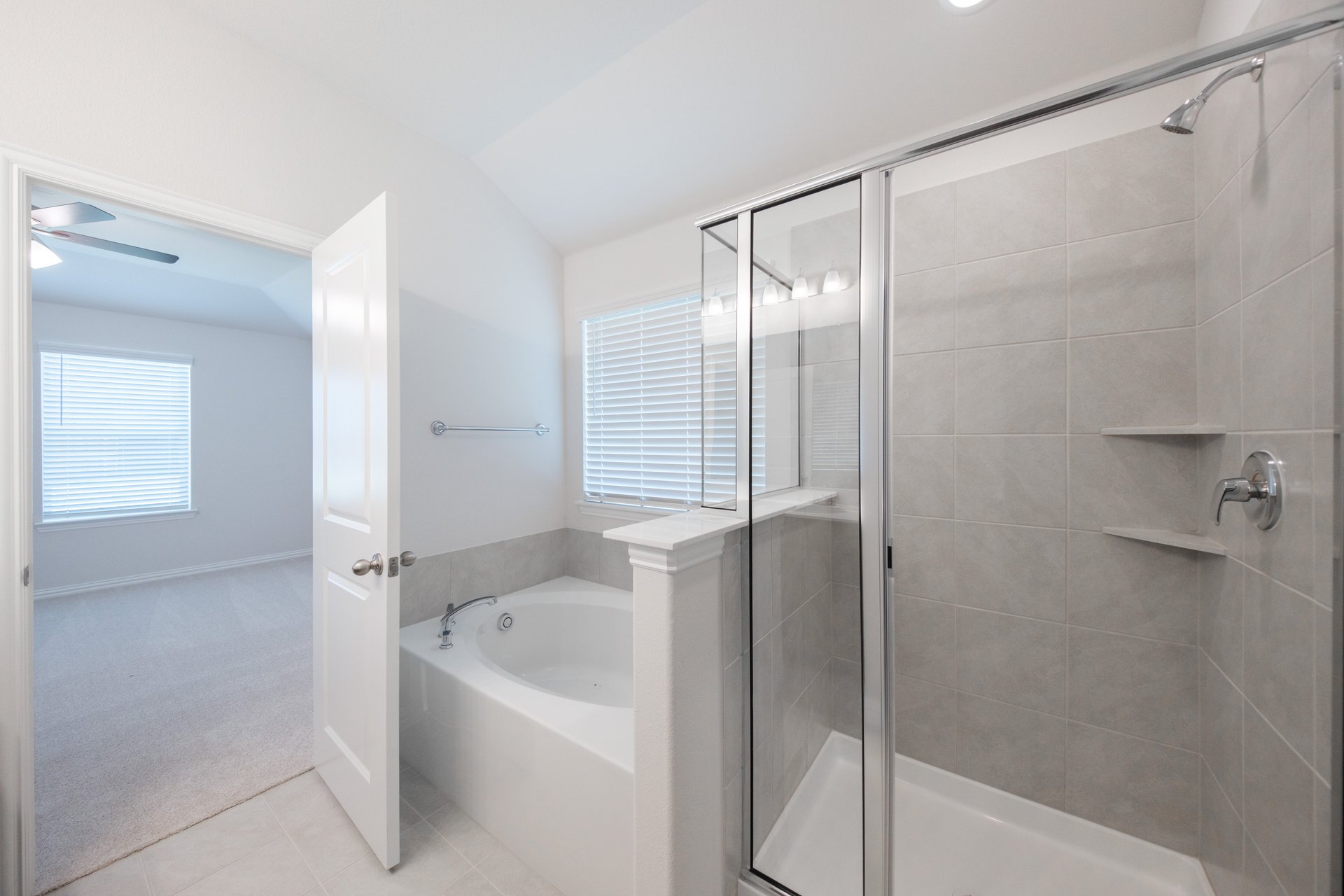 primary bathroom with soaking tub and walk-in shower