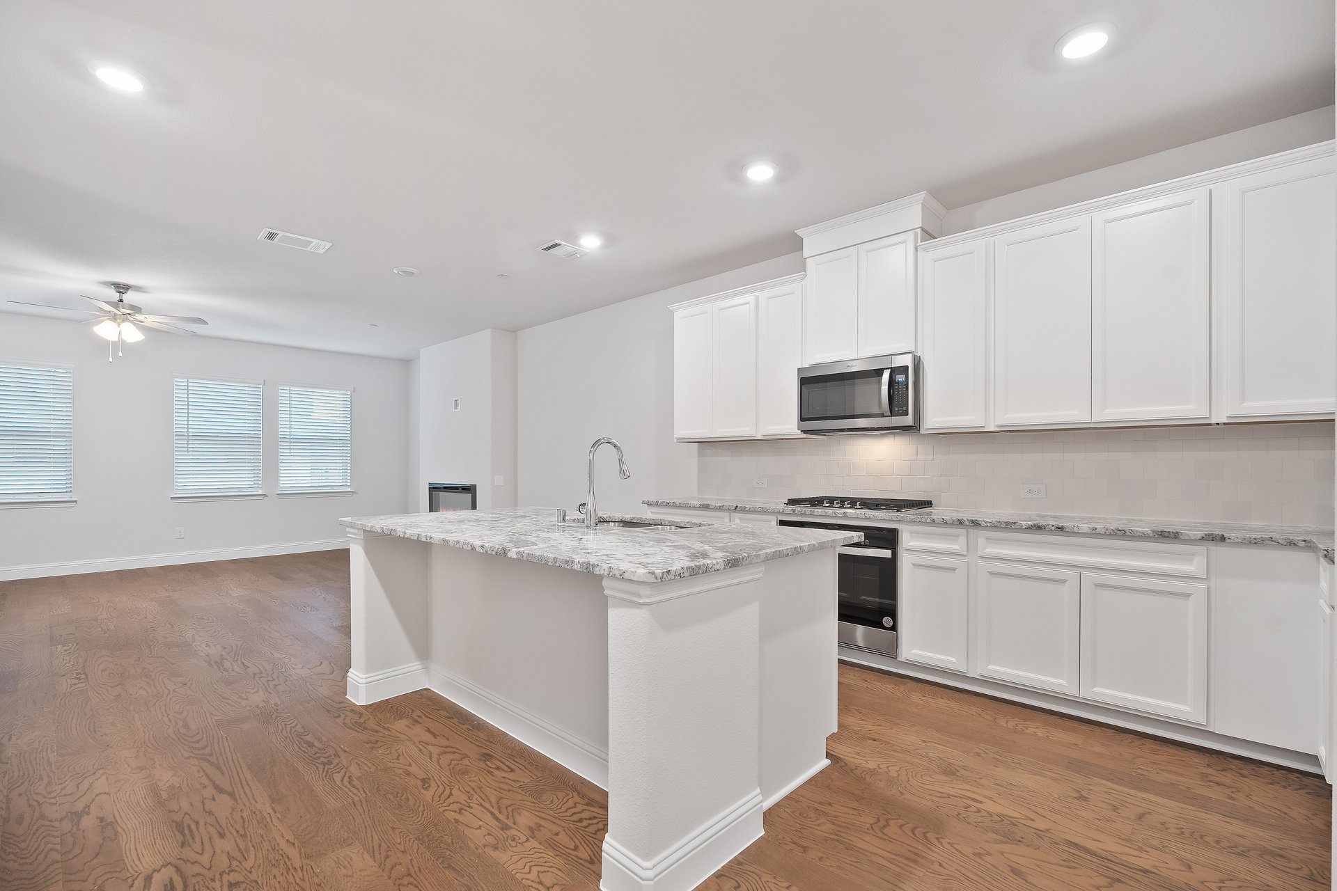 kitchen with island and white cabinets
