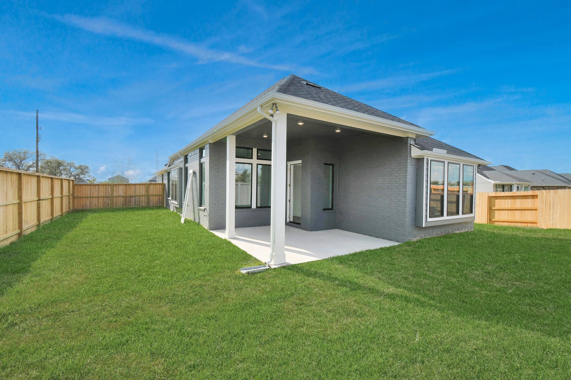 Backyard with covered patio.