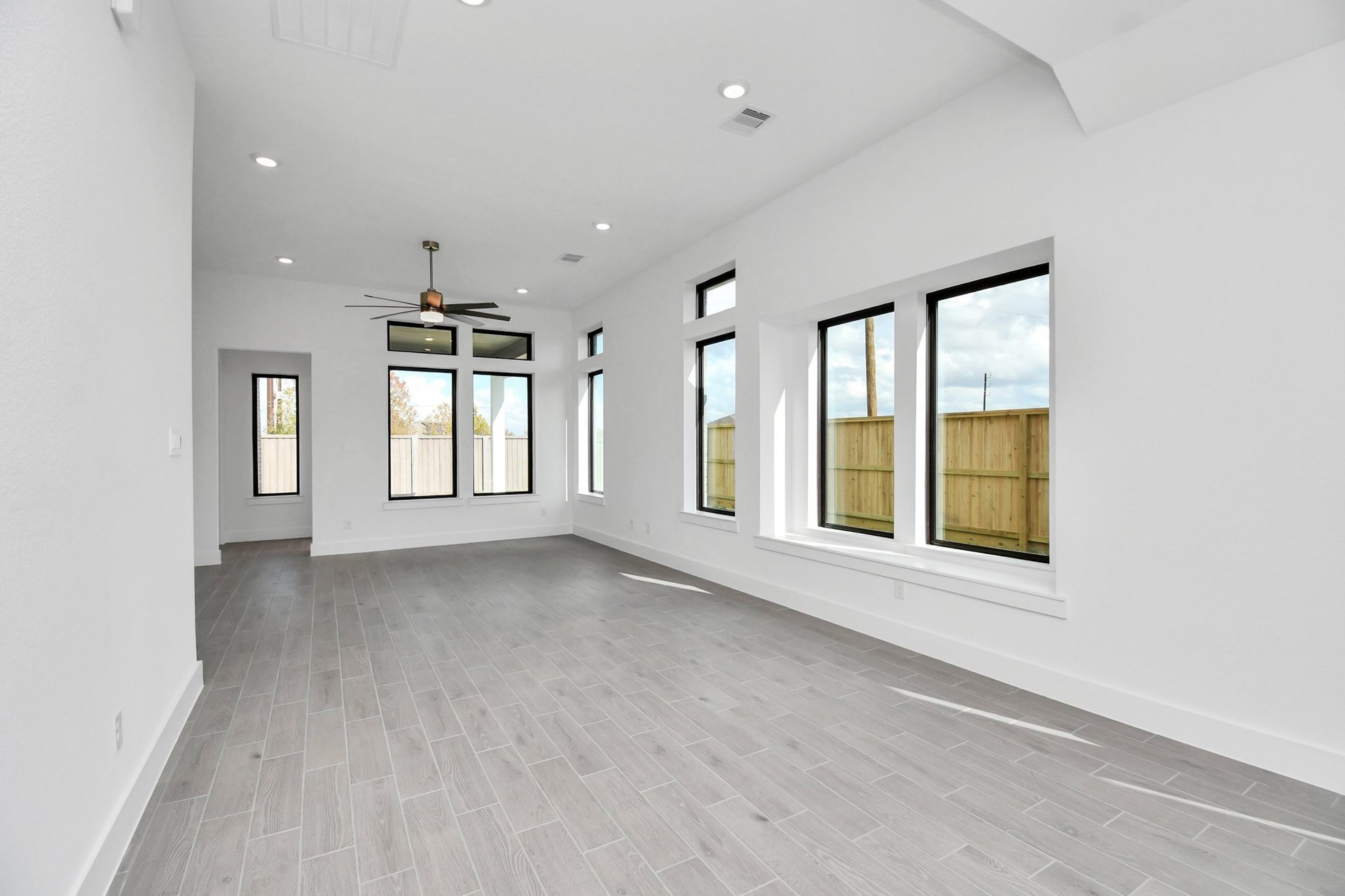 Great room with wood-like flooring