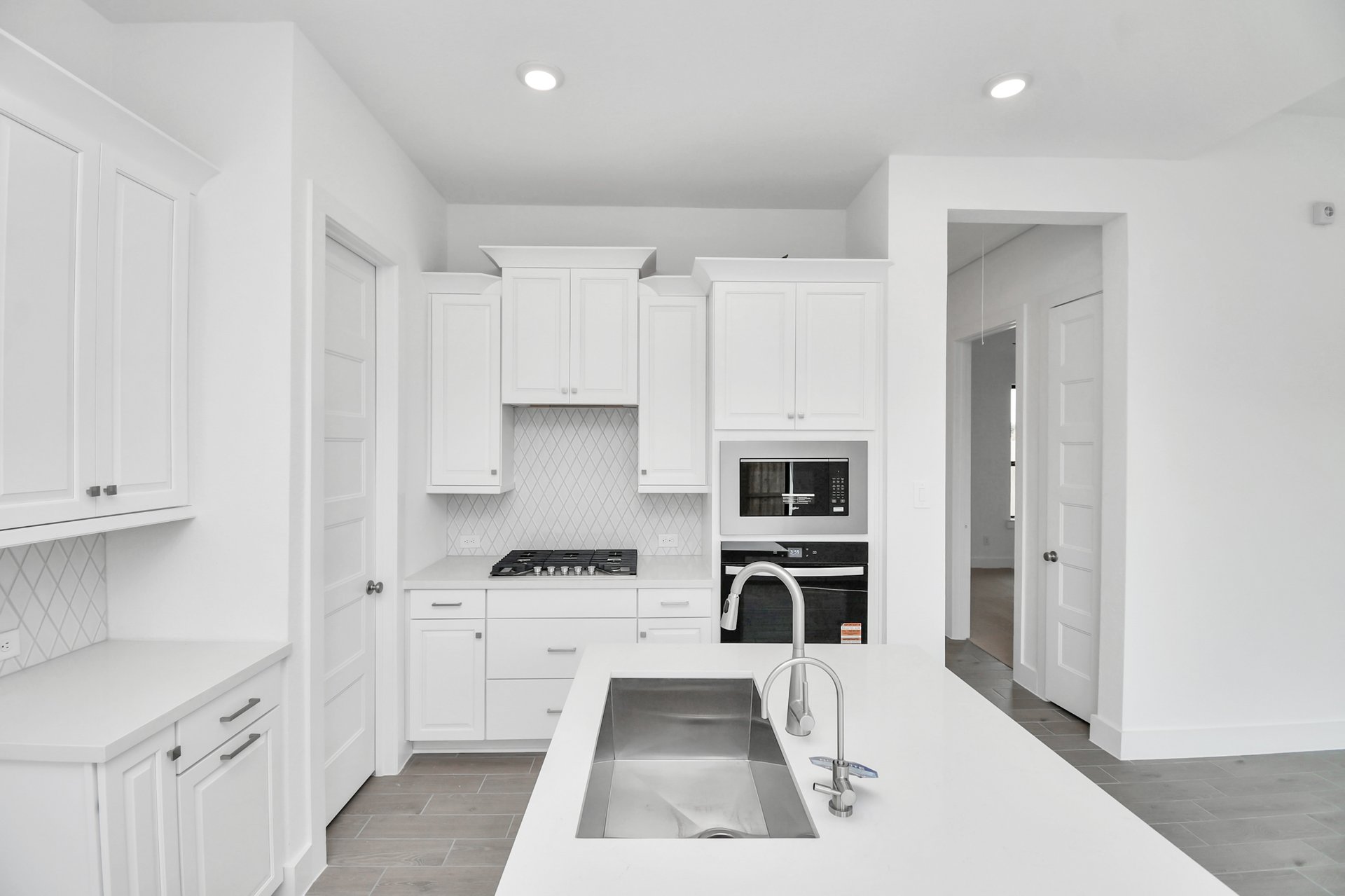 Kitchen with white cabinets.
