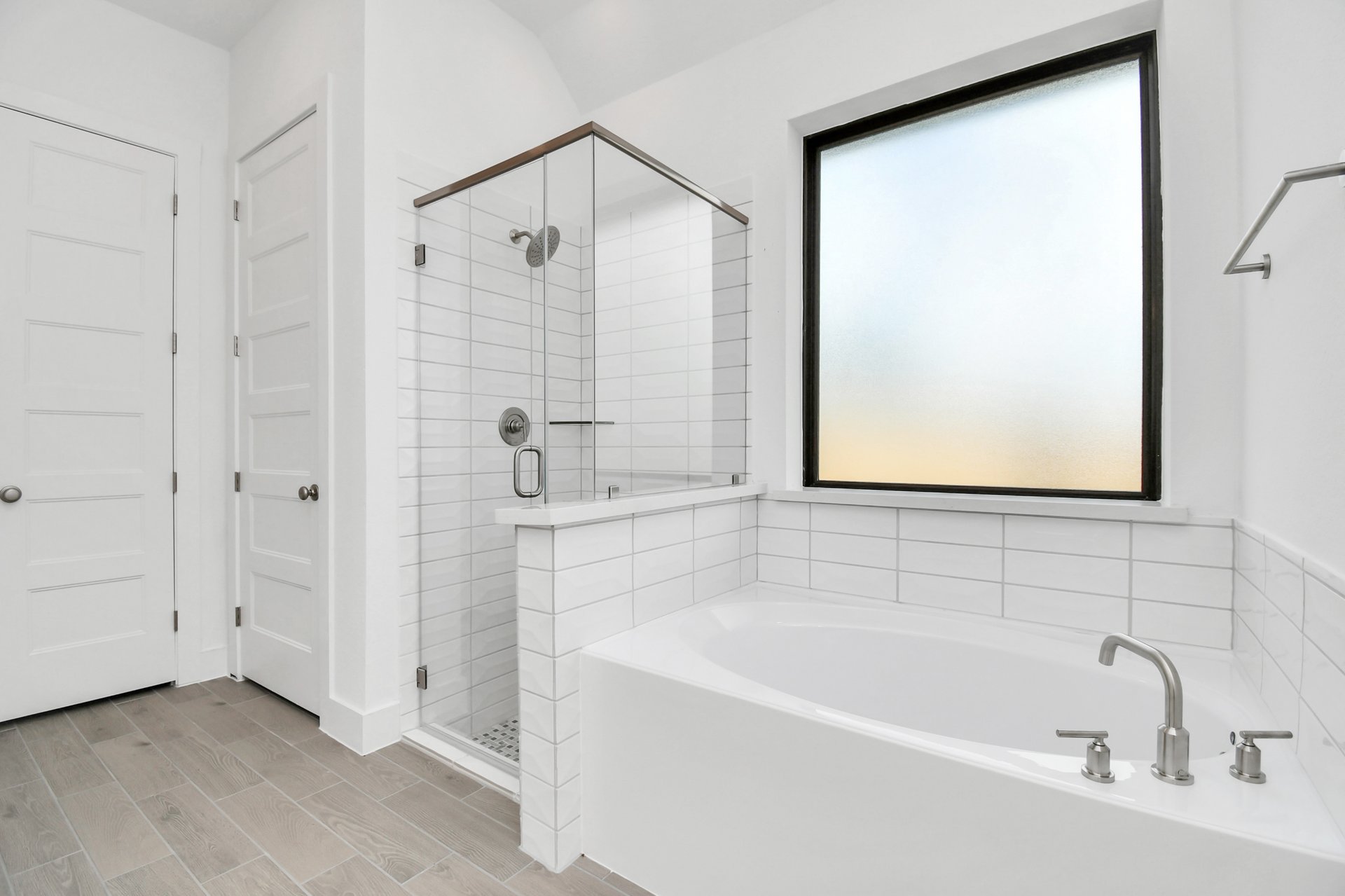 Primary bathroom with tub and shower