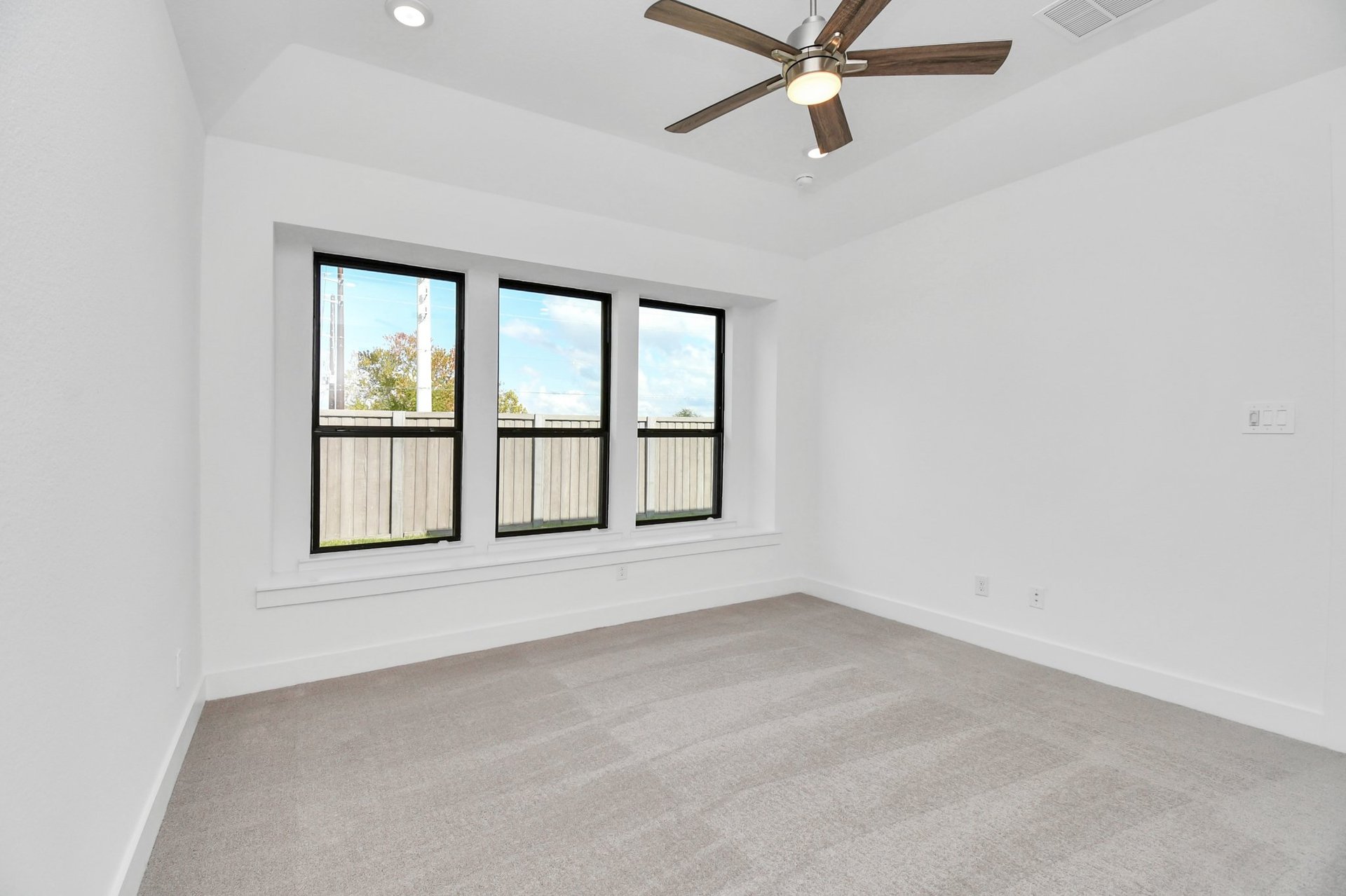 Primary Bedroom with carpet.