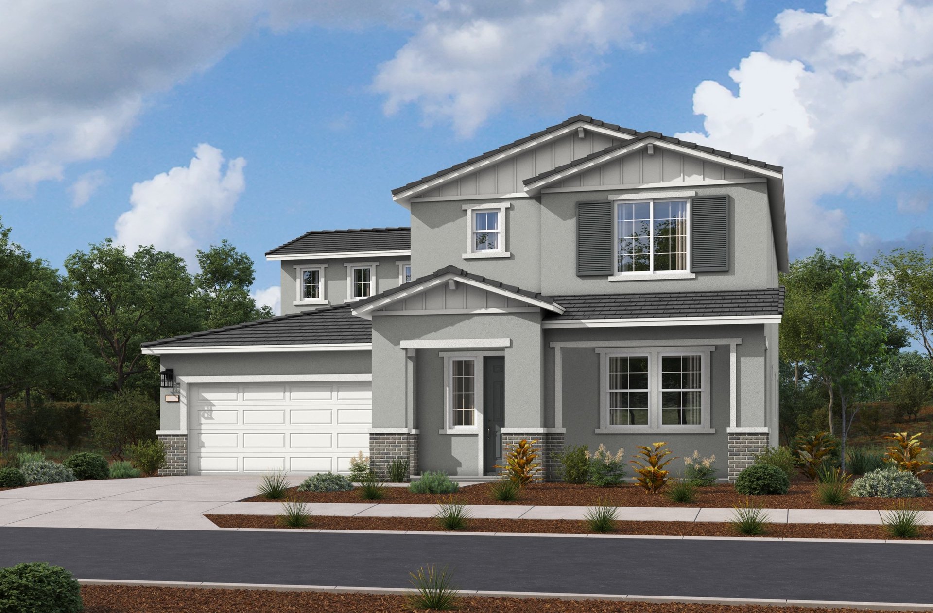 exterior of two-story home with desert landscaping and white garage