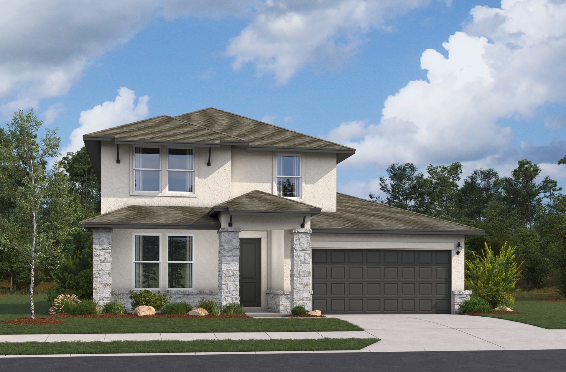 exterior with grass, trees & a 2-car garage