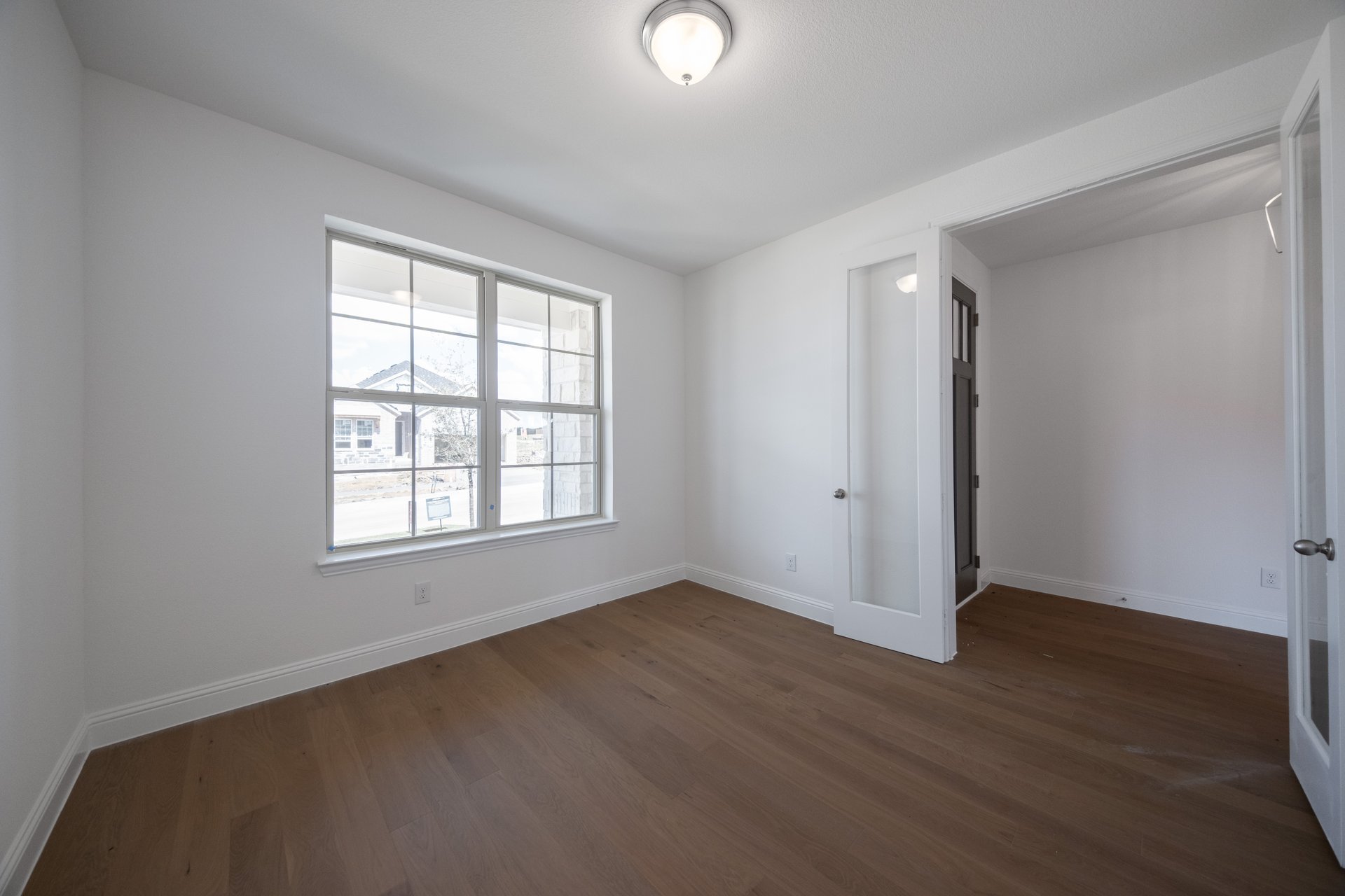 spacious study with hardwood flooring