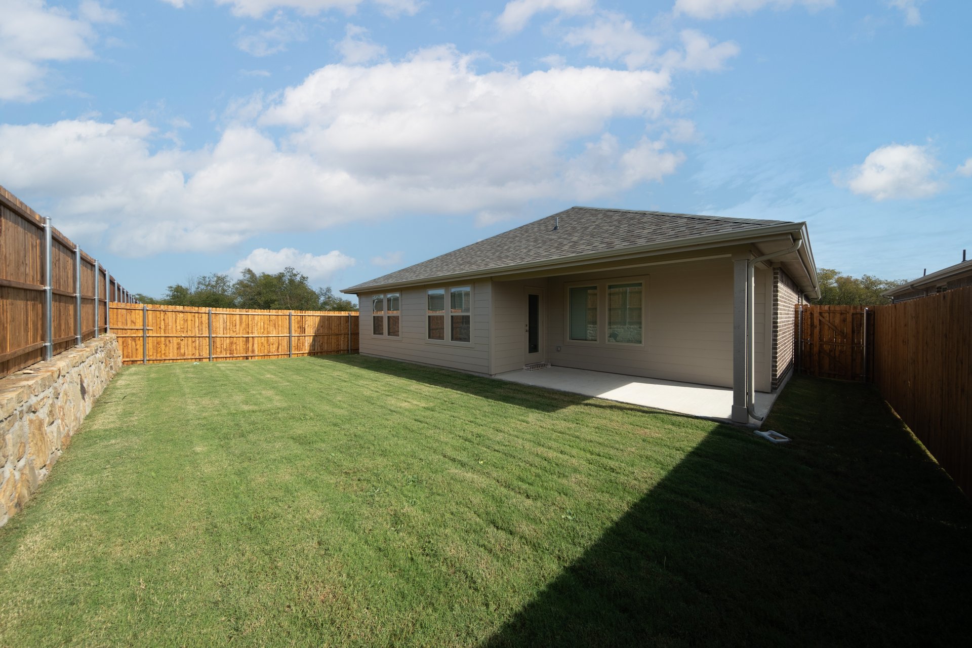 backyard of home with covered back patio