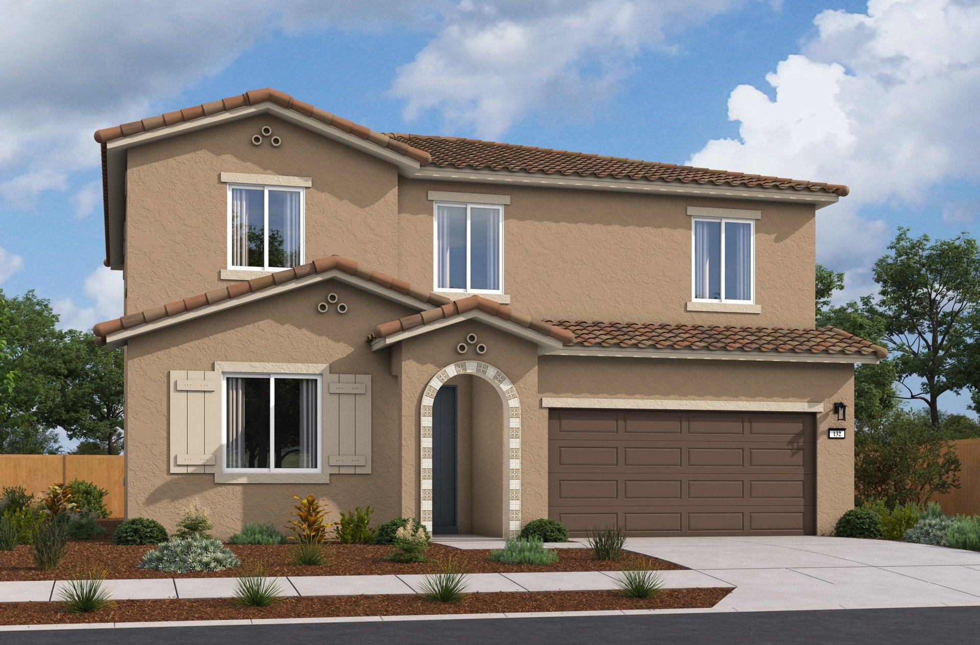 front exterior of two-story tan and brown spanish style home
