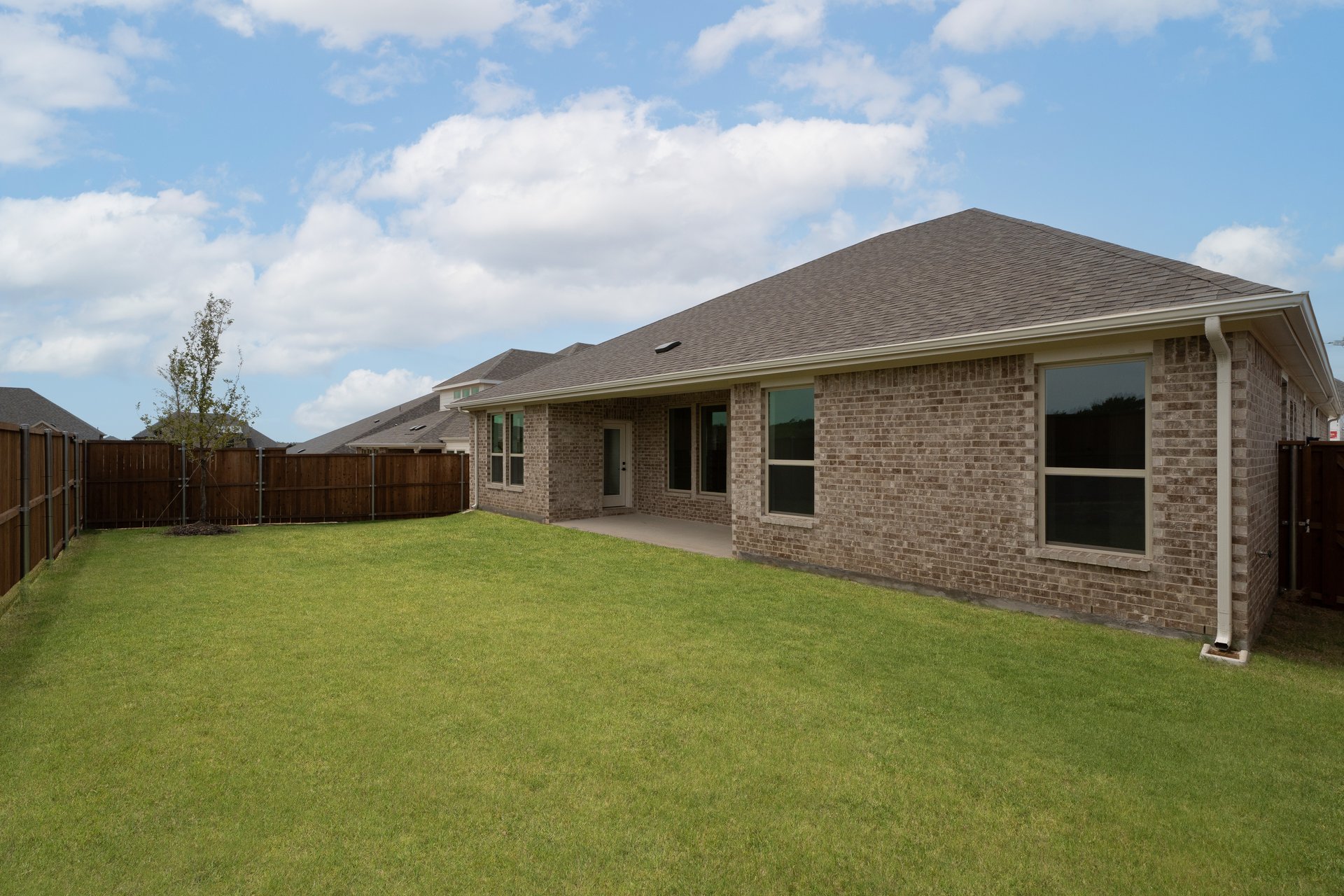 backyard of home with covered patio