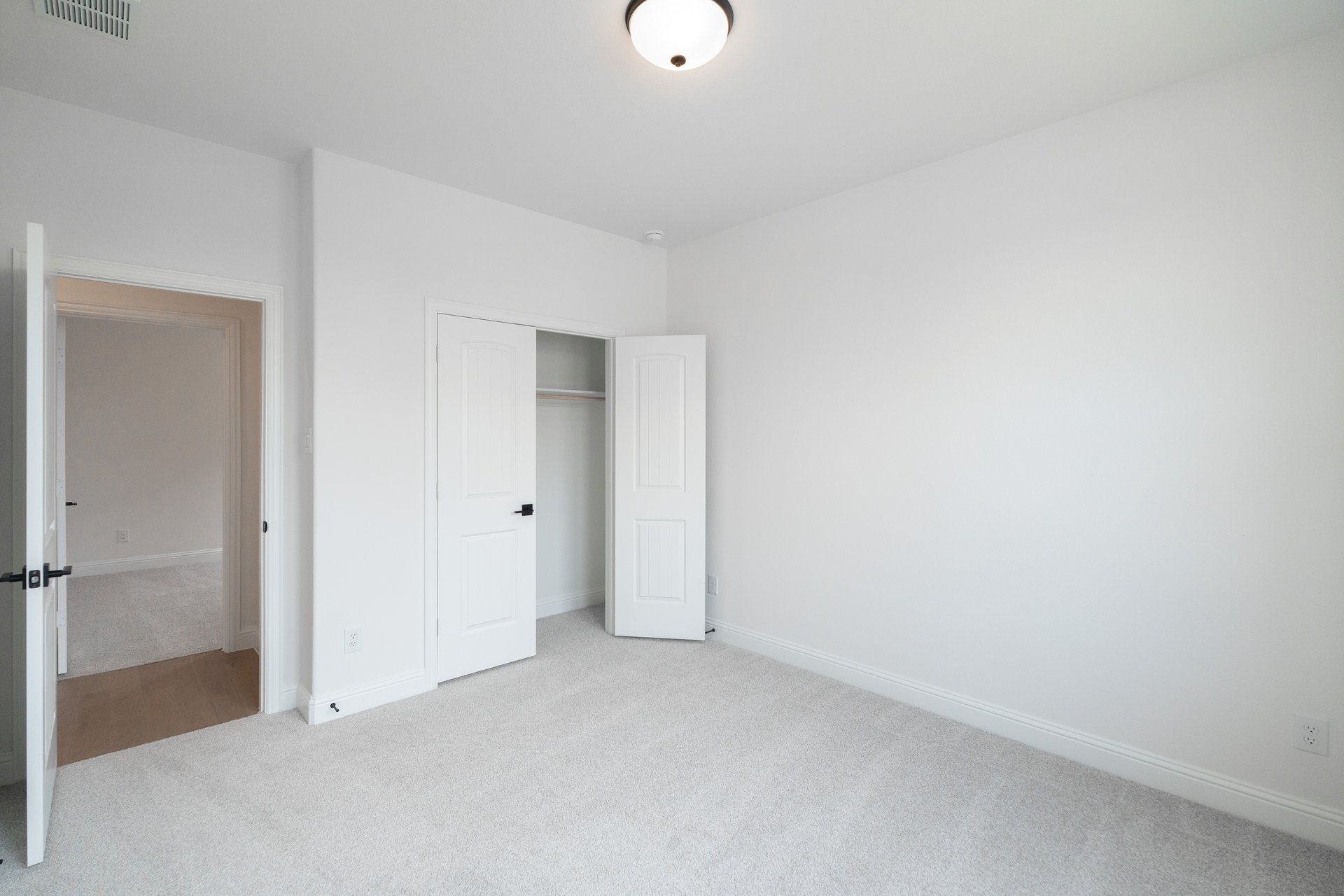 guest bedroom with carpet
