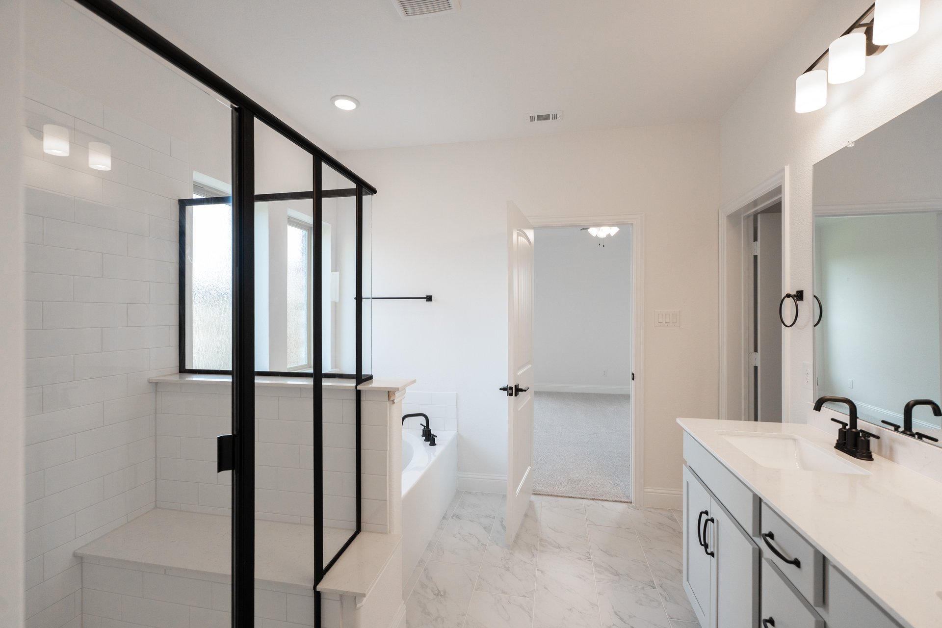 primary bathroom with soaking tub and shower