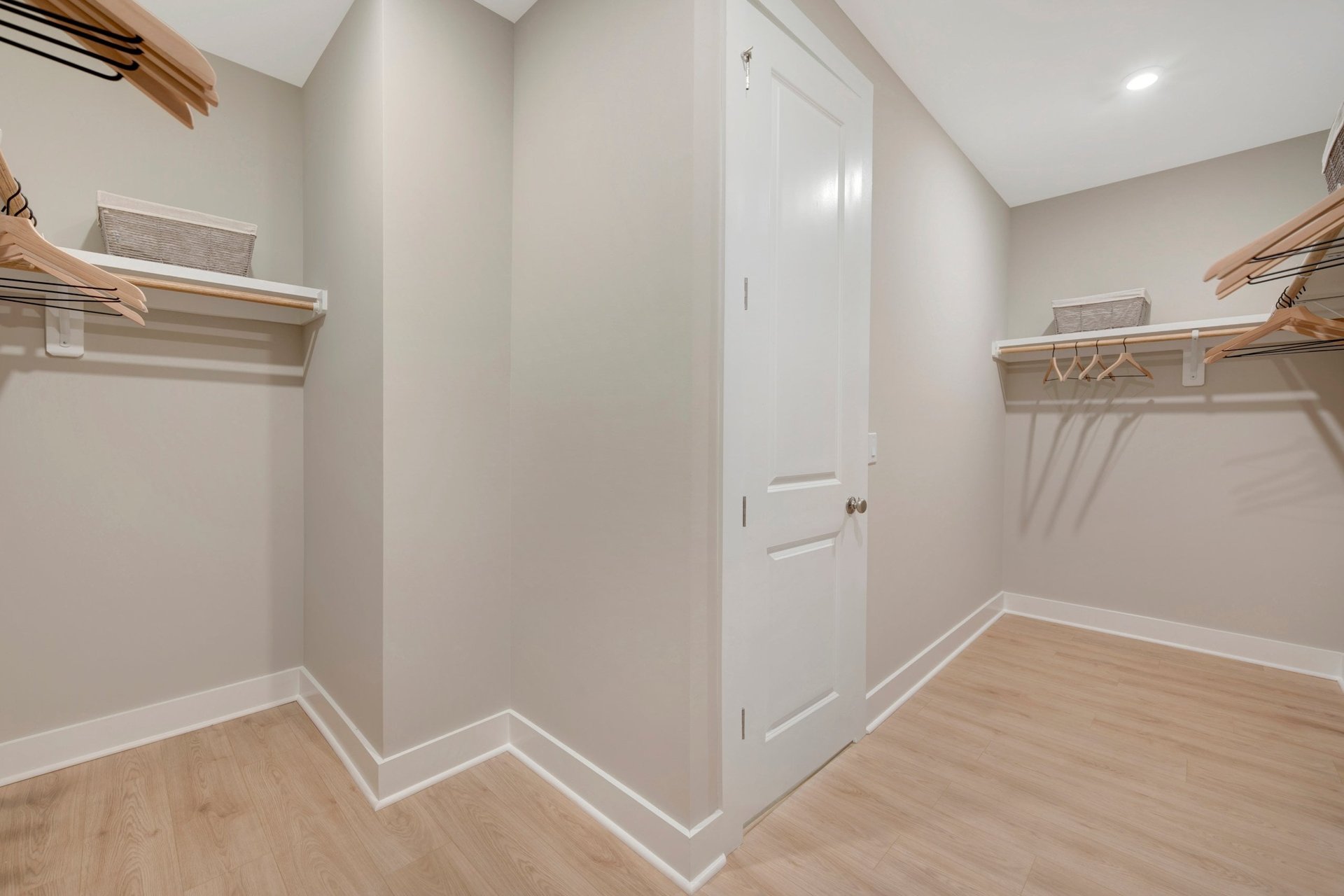 primary closet with wooden shelves
