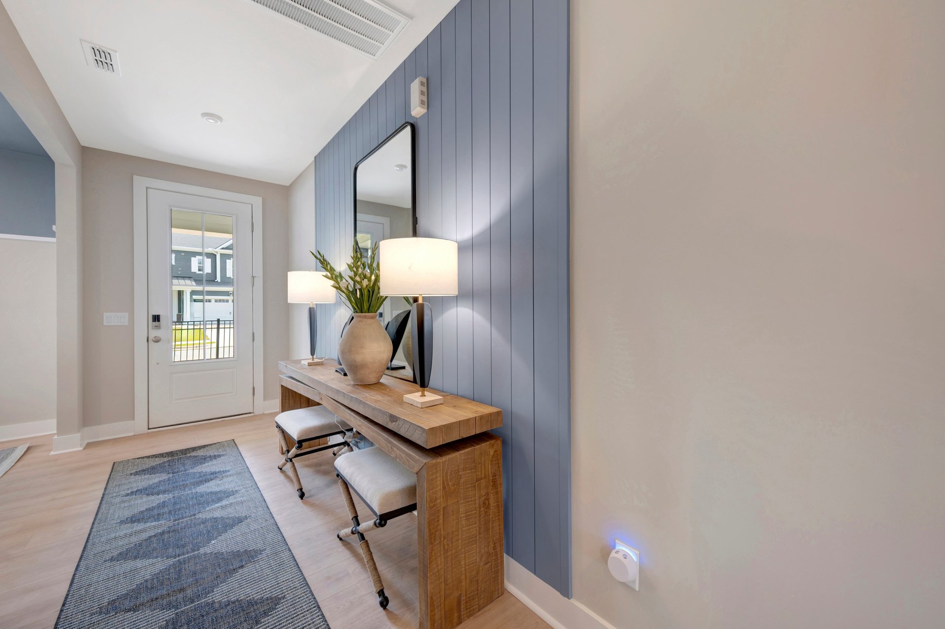 foyer with a view of the front door with a window