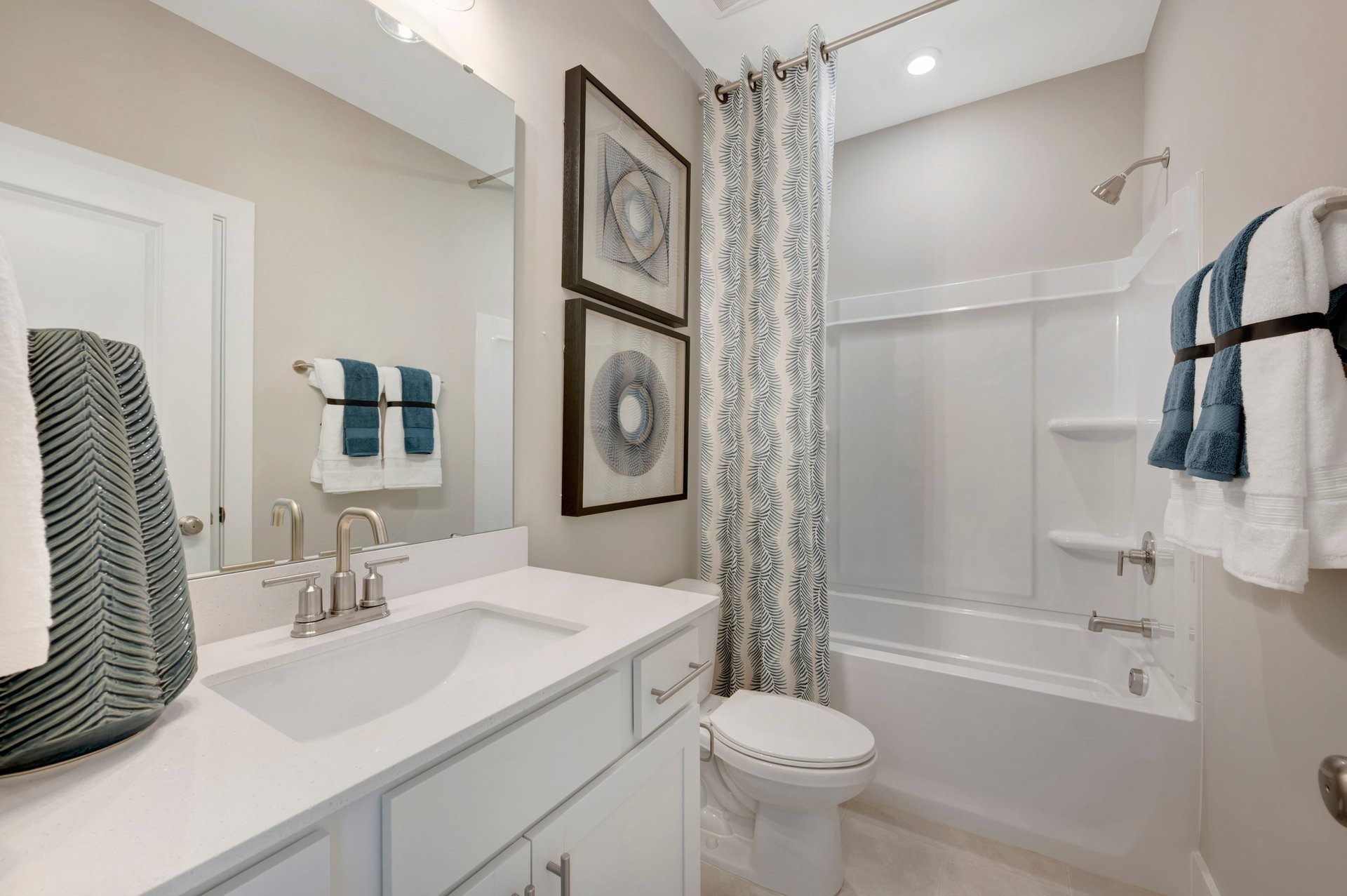 secondary bath with a tub and shower combo