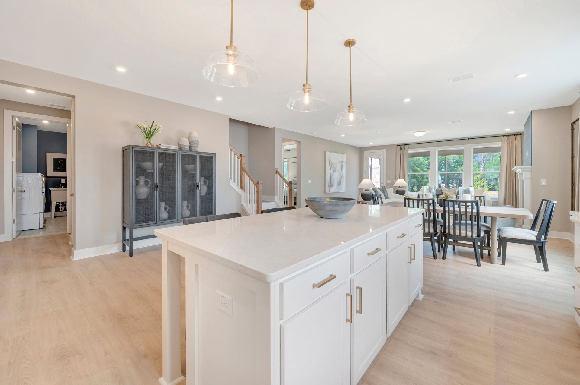 kitchen with view of laundry and breakfast area