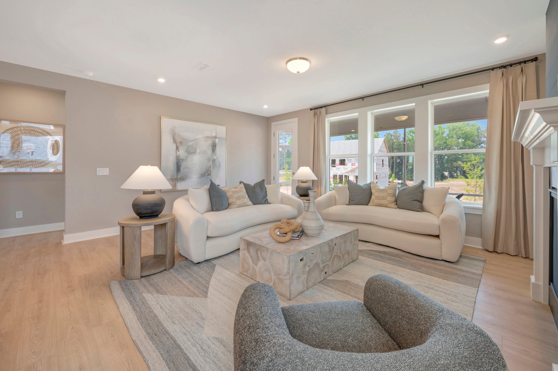 great room with multiple windows and a rug