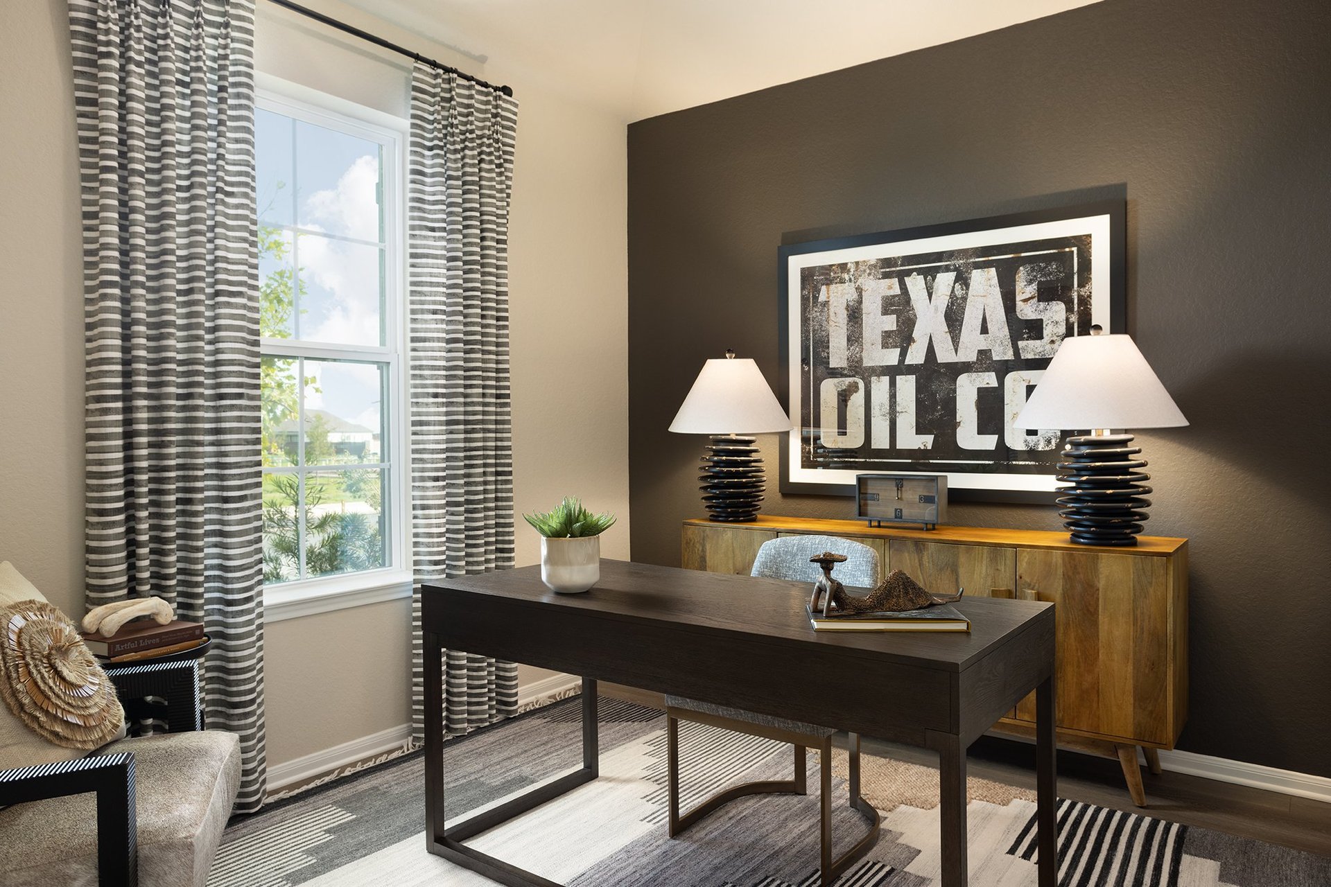 study with brown flooring, window & sloped ceiling