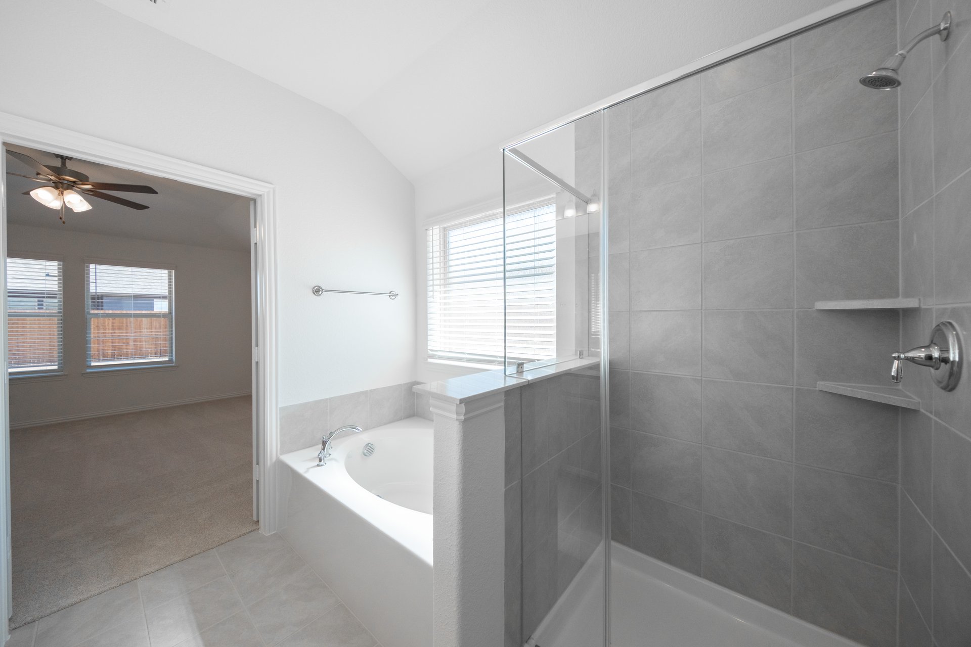 primary bathroom with walk-in shower and soaking tub