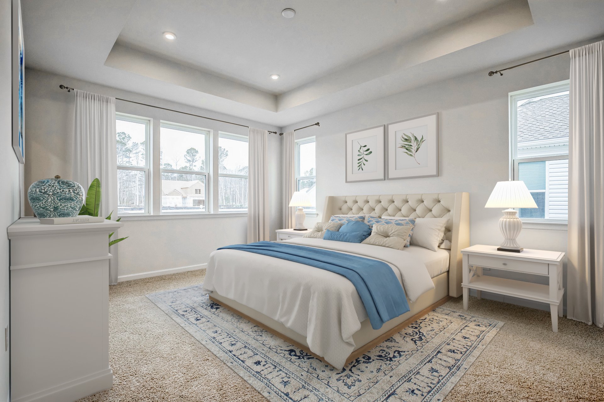 primary suite with carpet and multiple windows