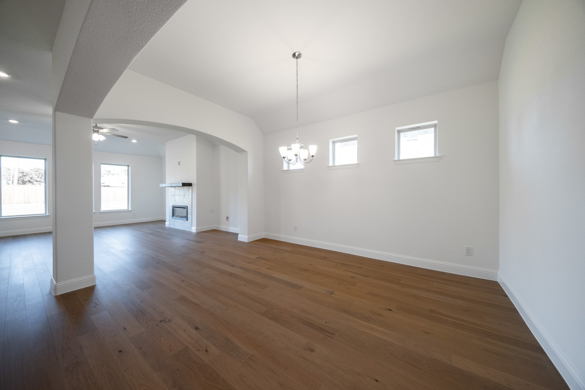 dining room with wood flooring and chandelier 