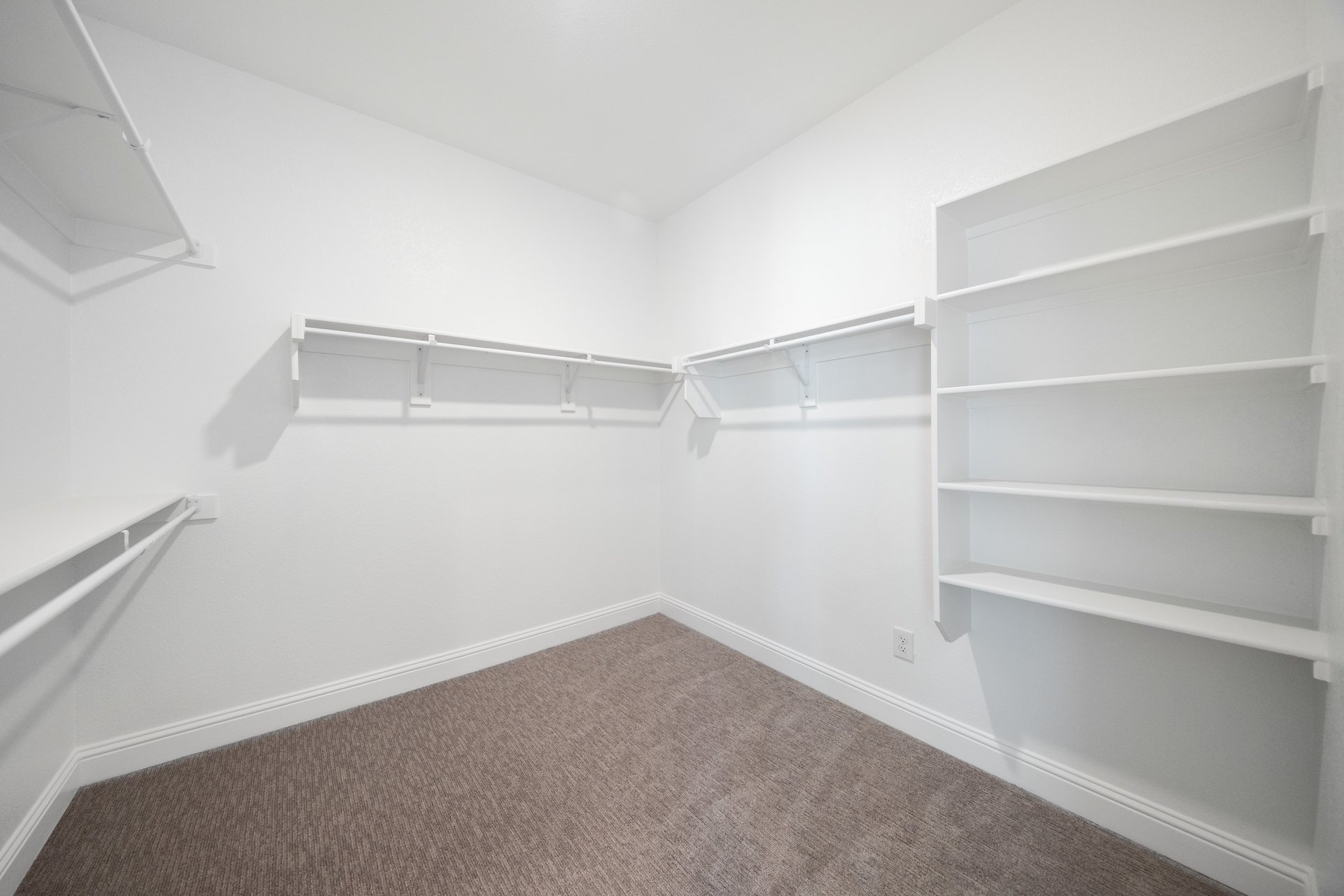 closet with hanging racks and shelves 