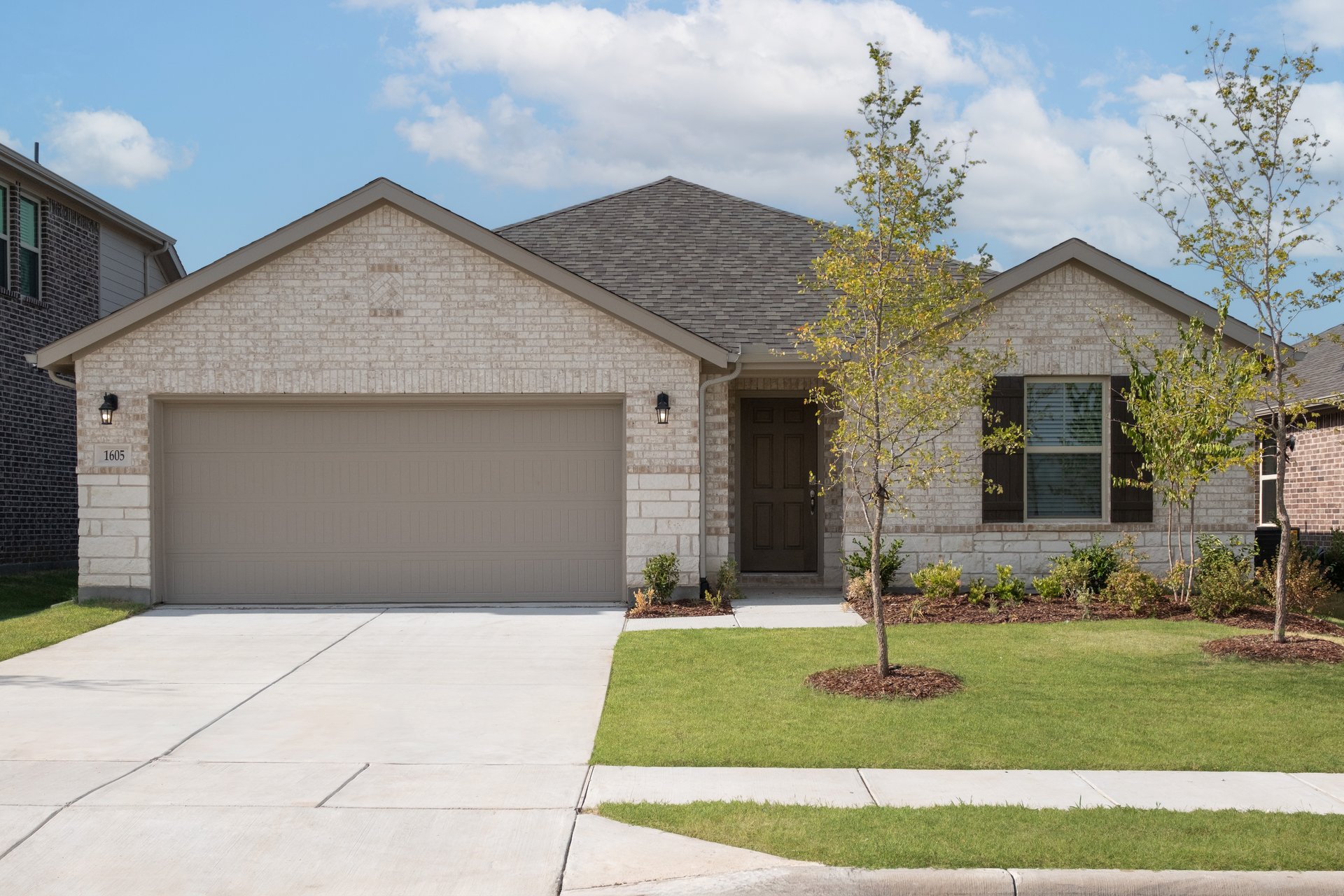 one-story with brick and stone exterior