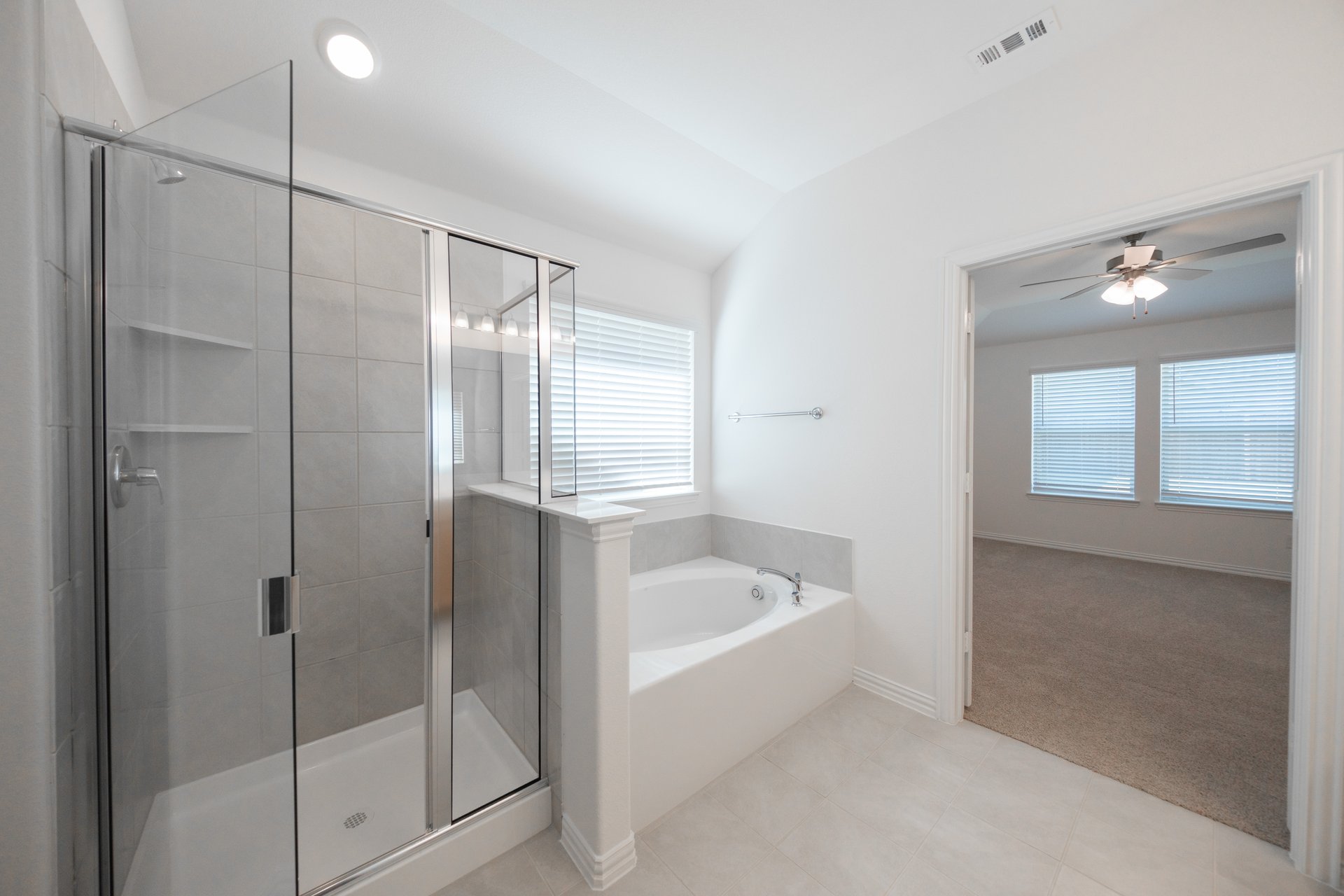 primary bathroom with soaking tub and walk-in shower