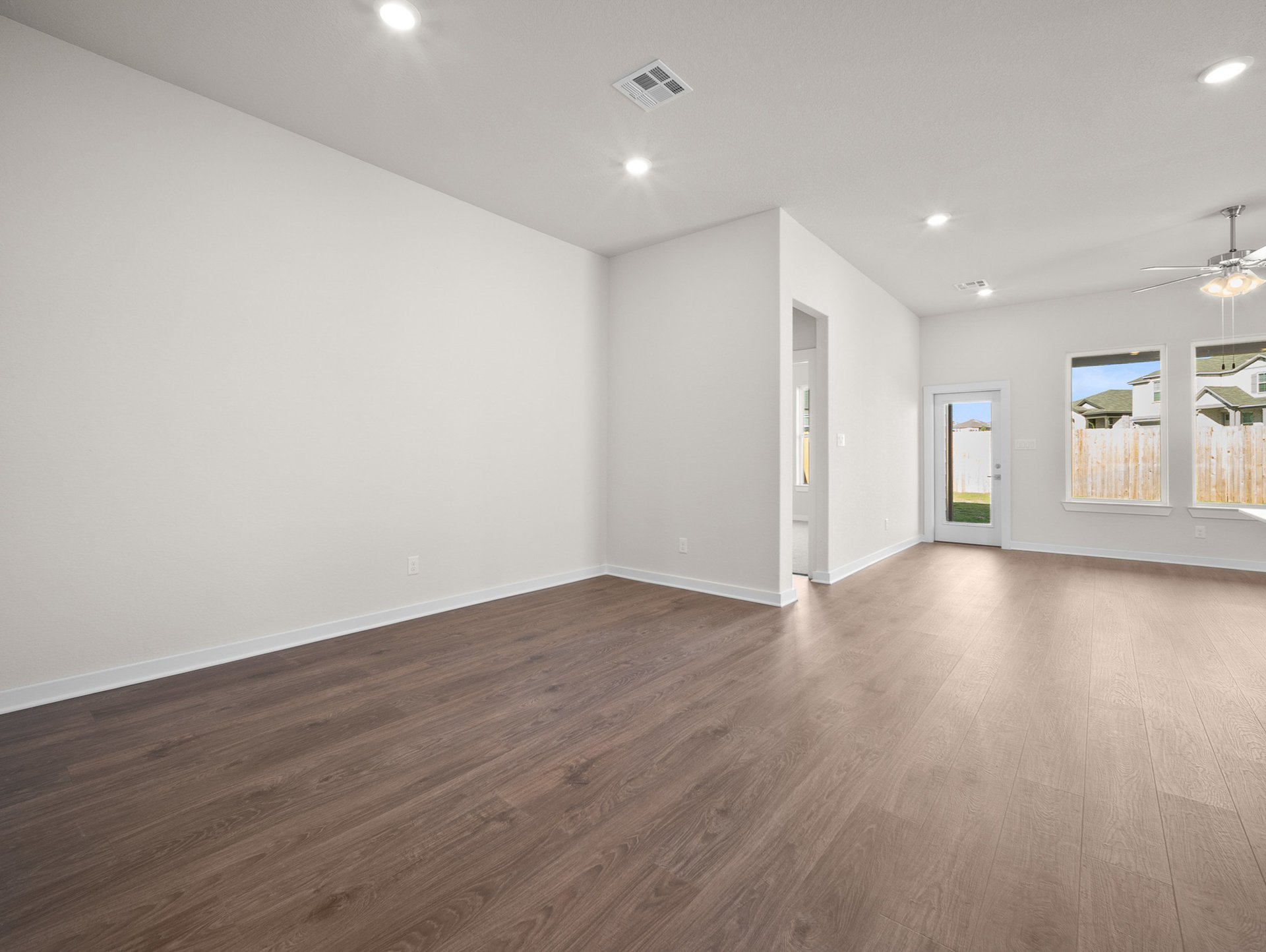 dining area with brown flooring & recessed lighting