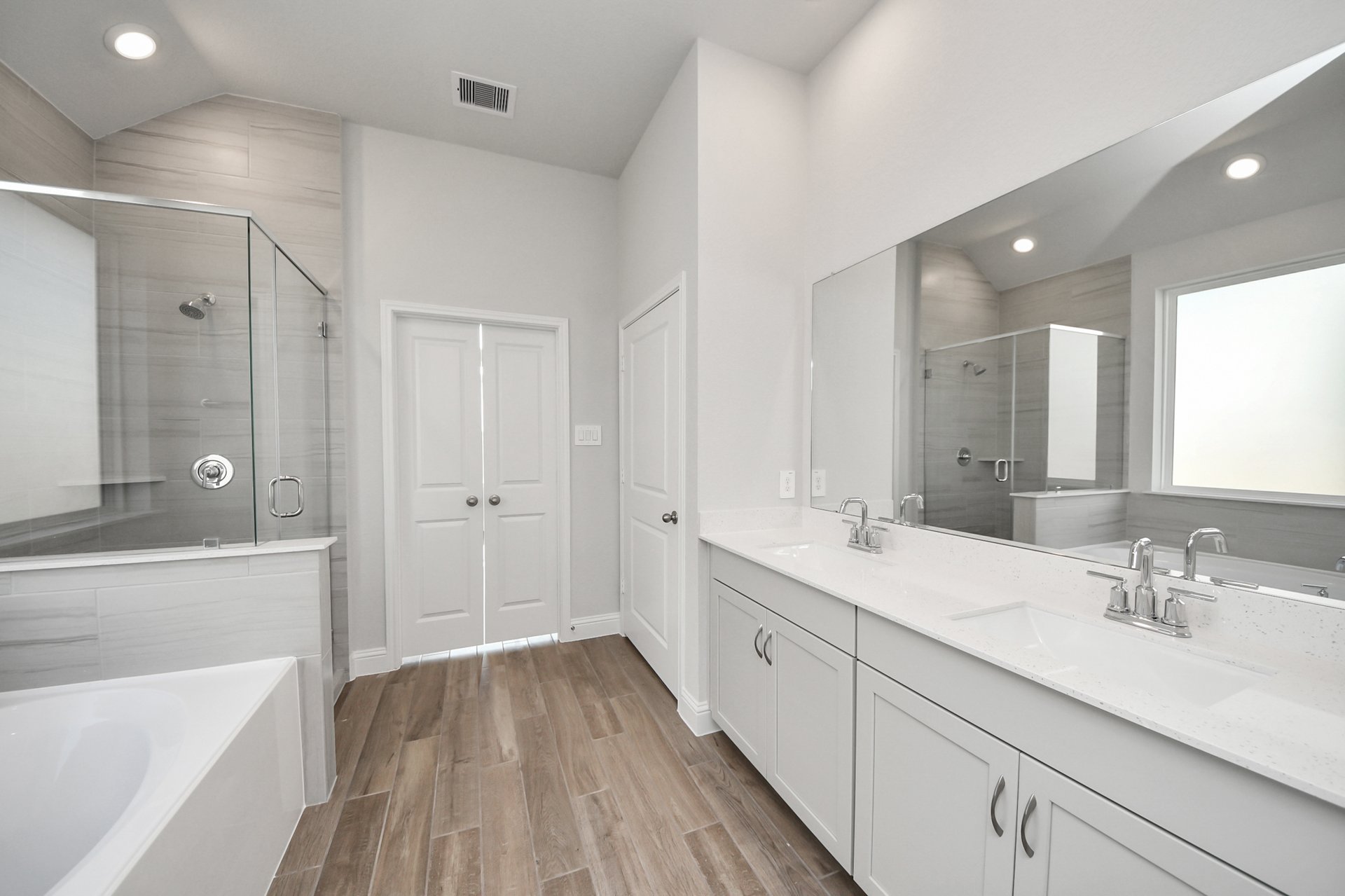 separate tub and shower with tile surround