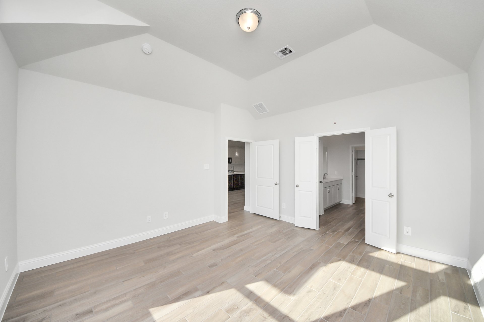 tall ceilings and wood flooring