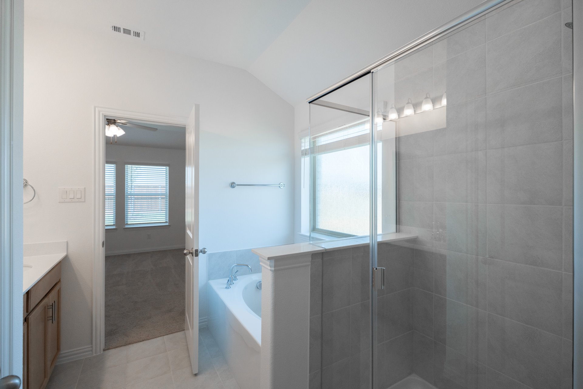 primary bathroom with soaking tub and walk-in shower