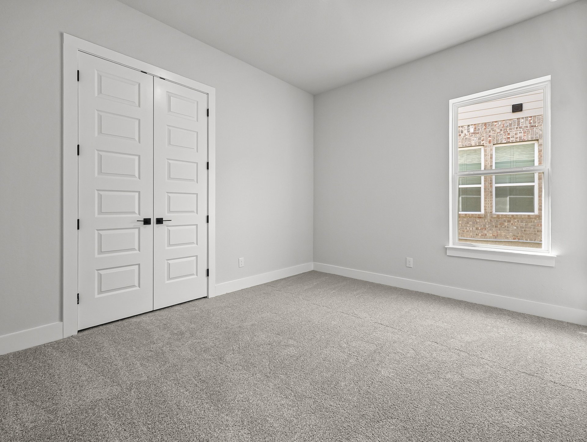 bedroom with carpet, windows & recessed lighting
