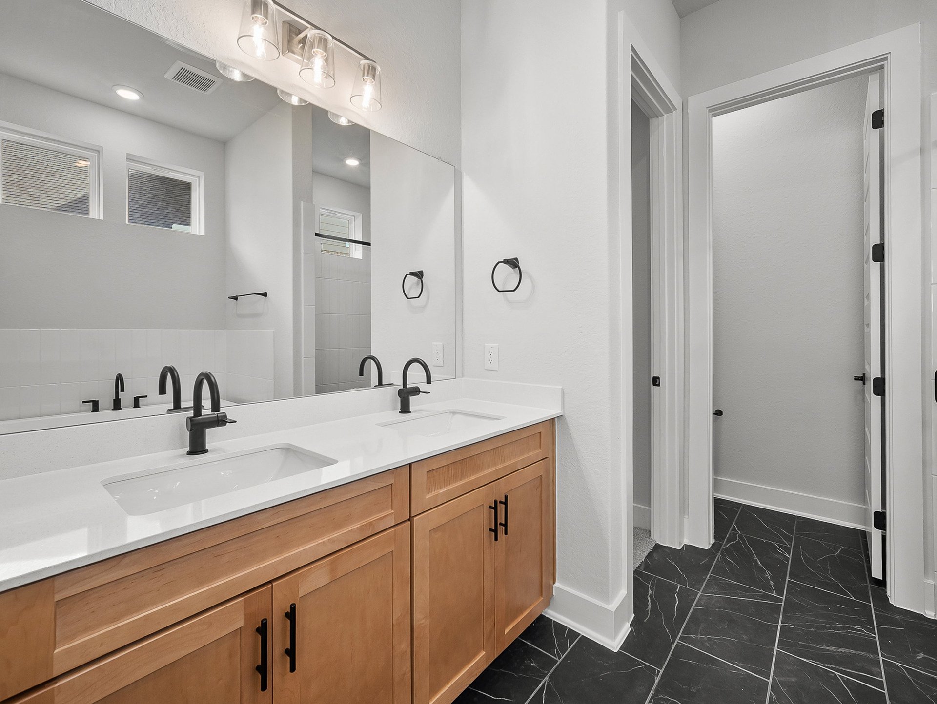 bathroom with soaking tub, walk-in shower & dual sinks