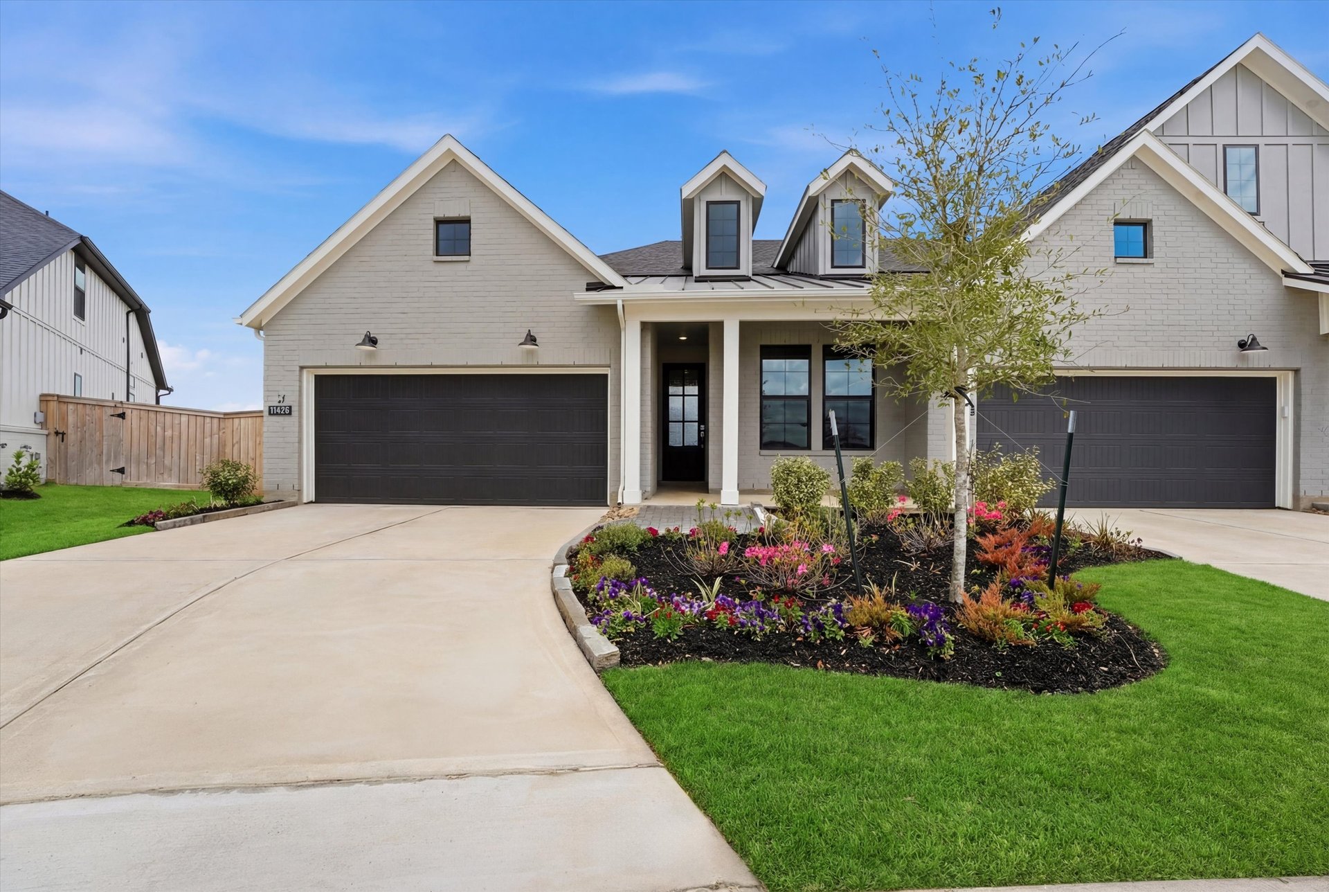 farmhouse-style exterior with beige siding