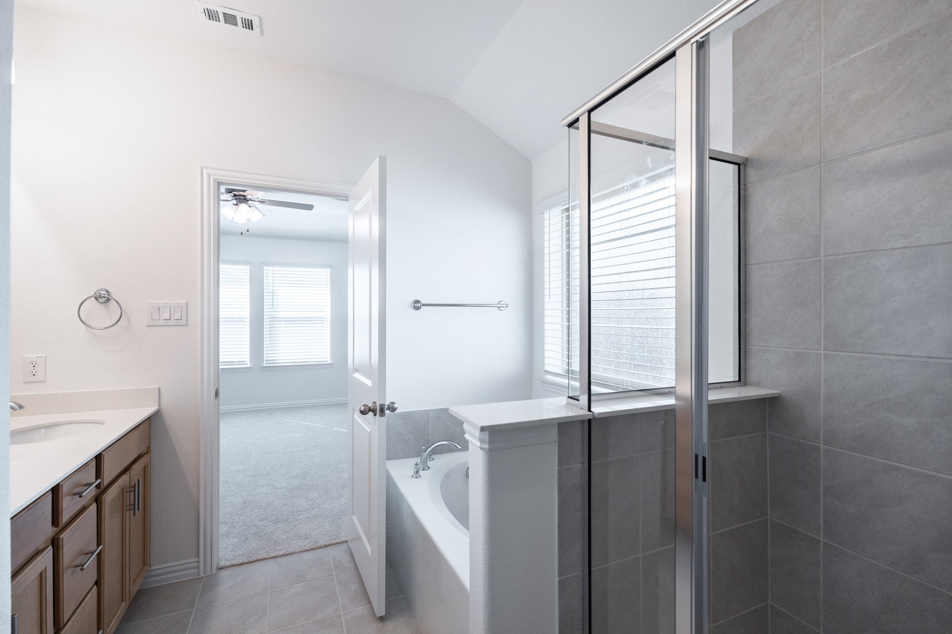 primary bathroom with shower and tub