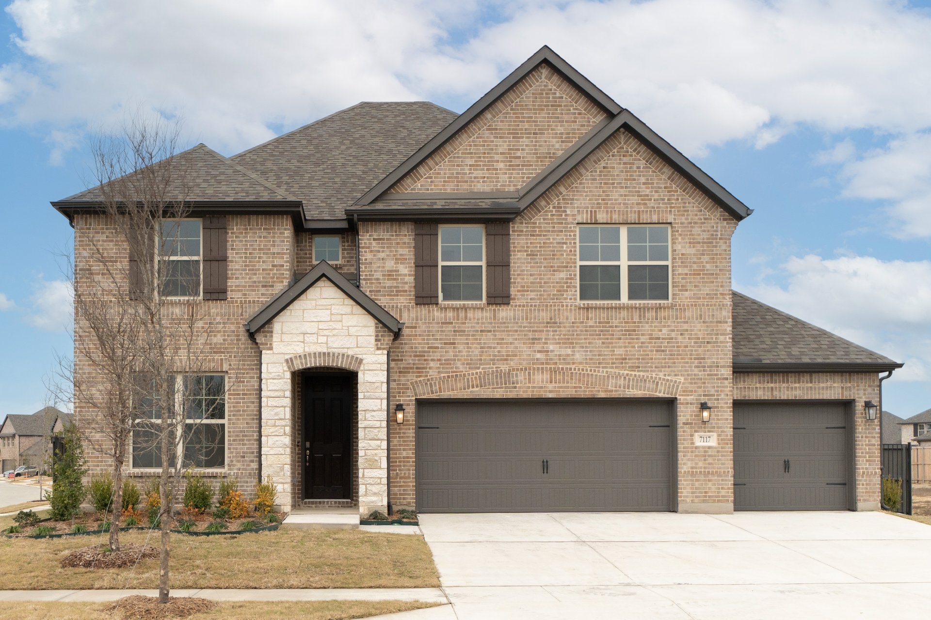 exterior of the home with brick and stone