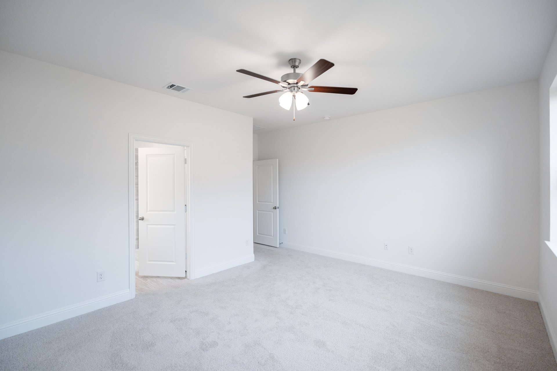 primary bedroom with carpet