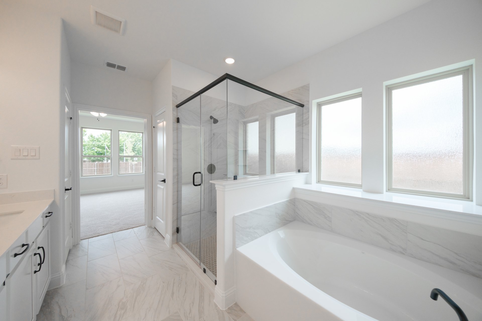 primary bathroom with soaking tub and walk-in shower