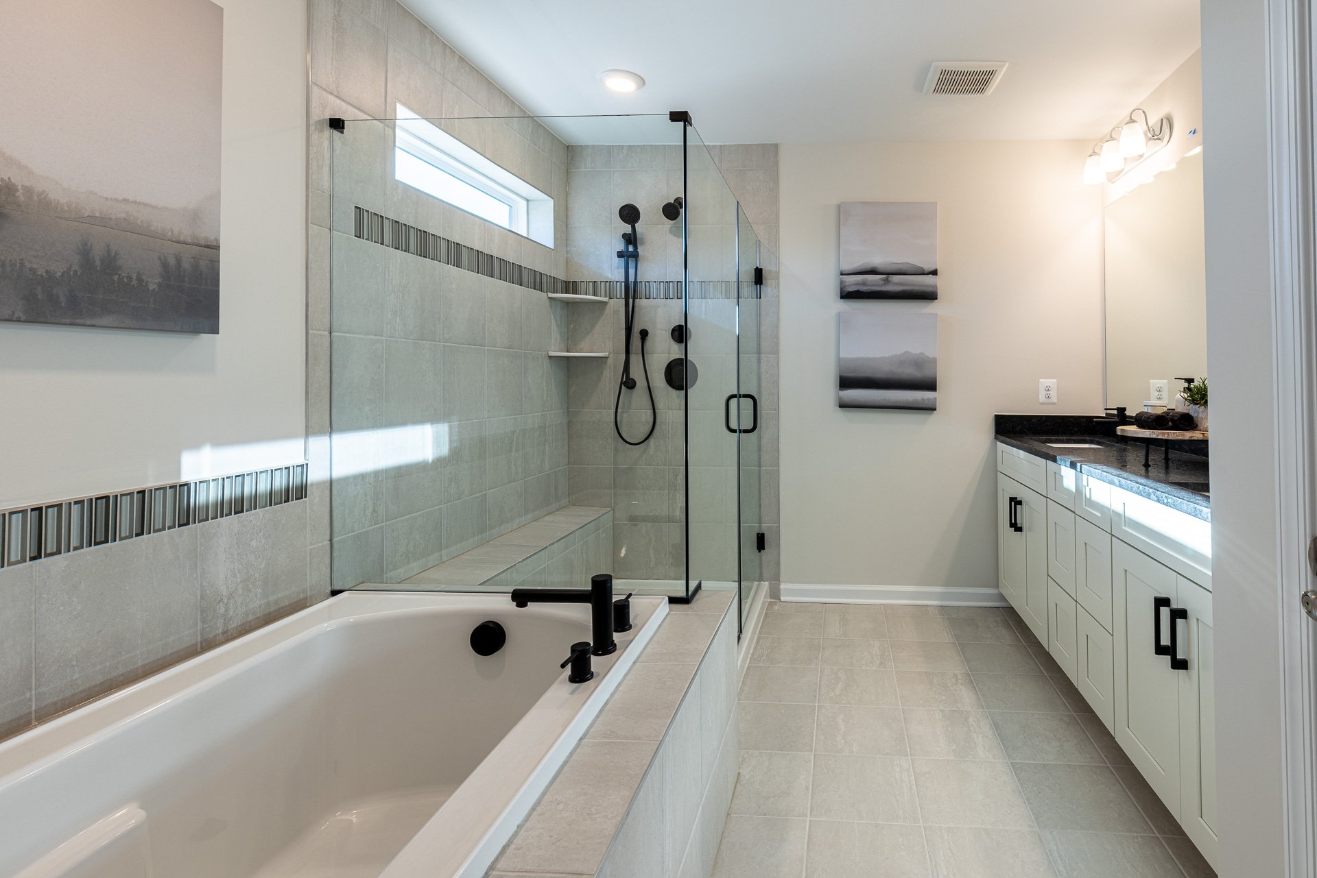 primary bath with a separate shower and soaking tub