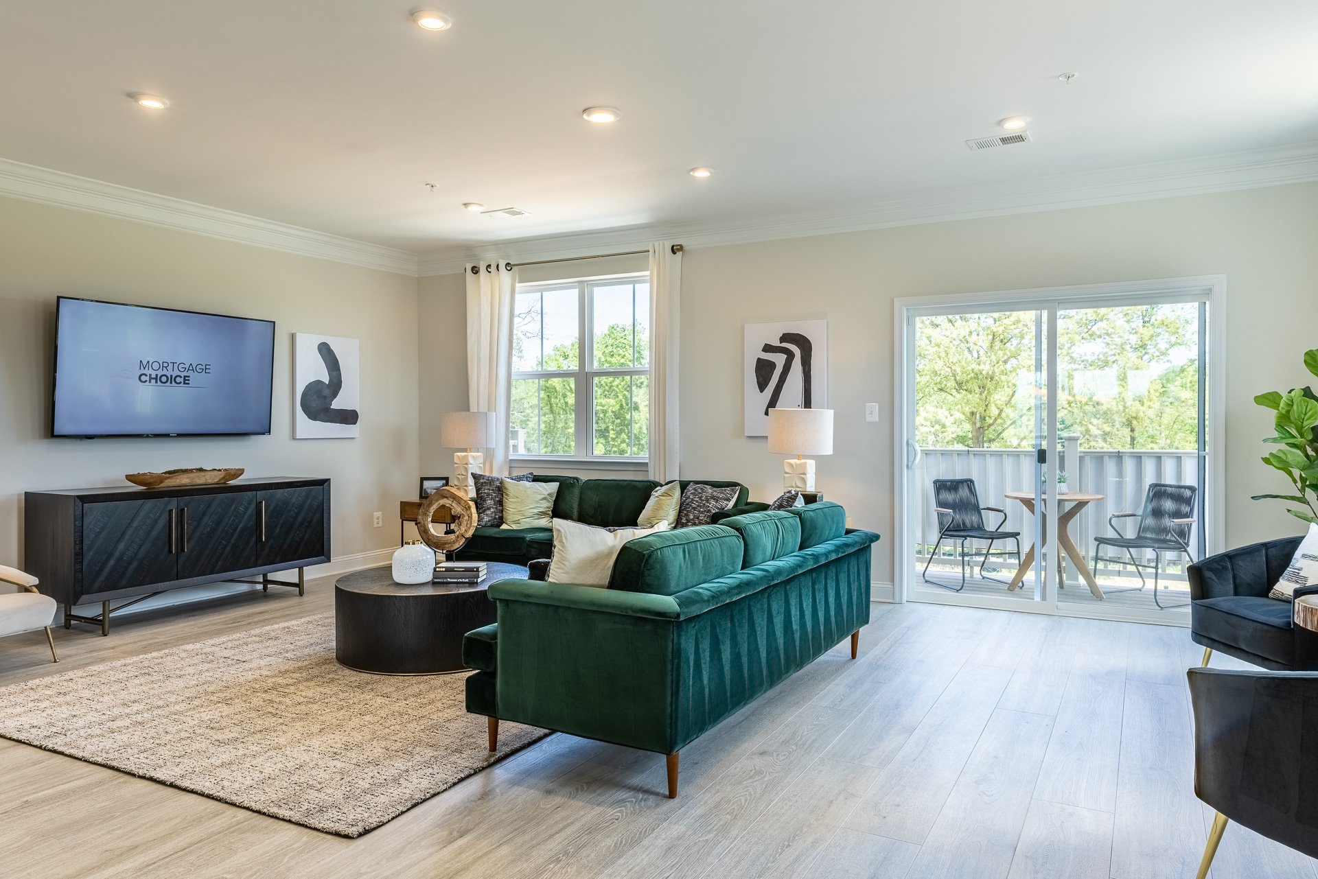great room with a green velvet couch