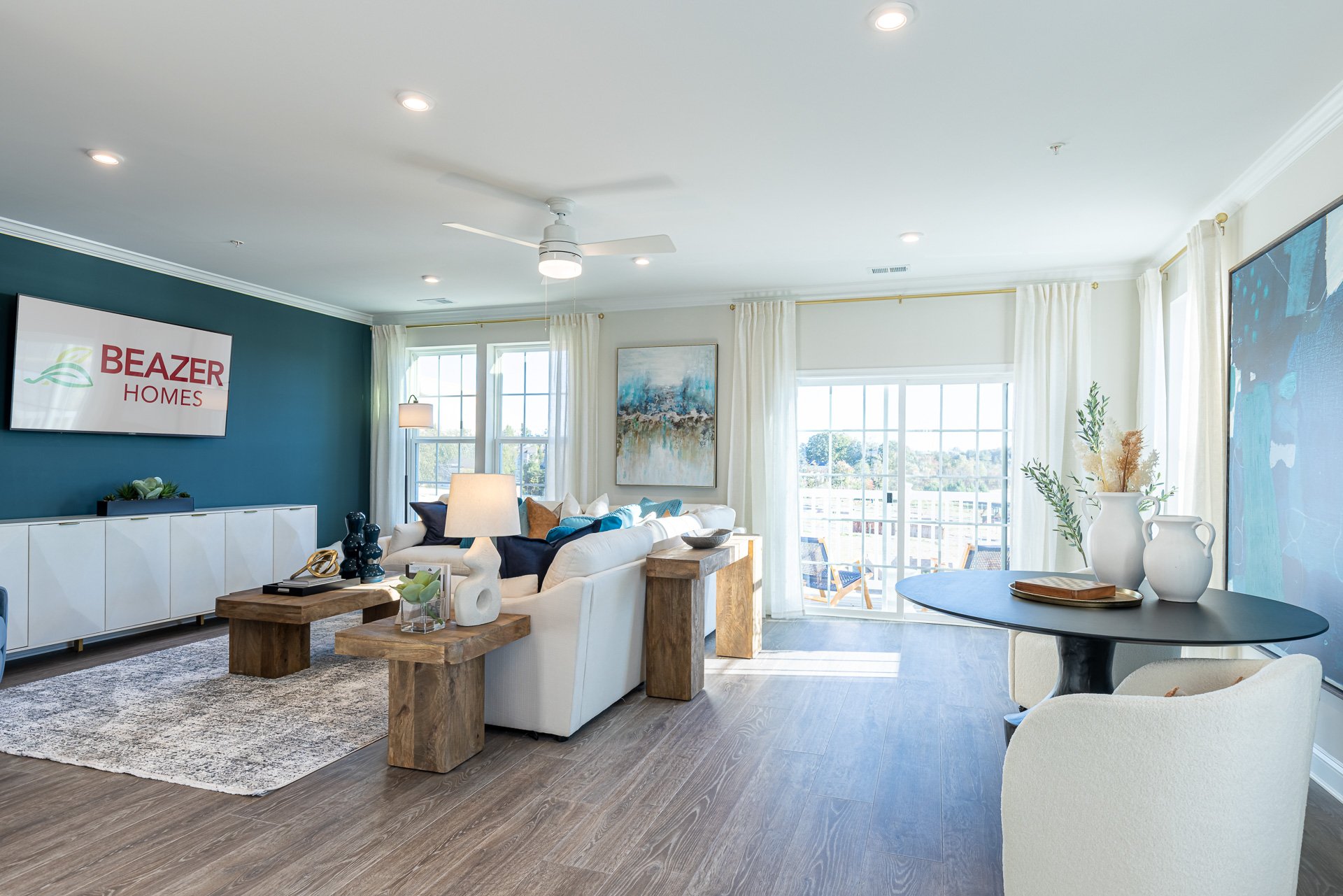 great room with couches and a coffee table