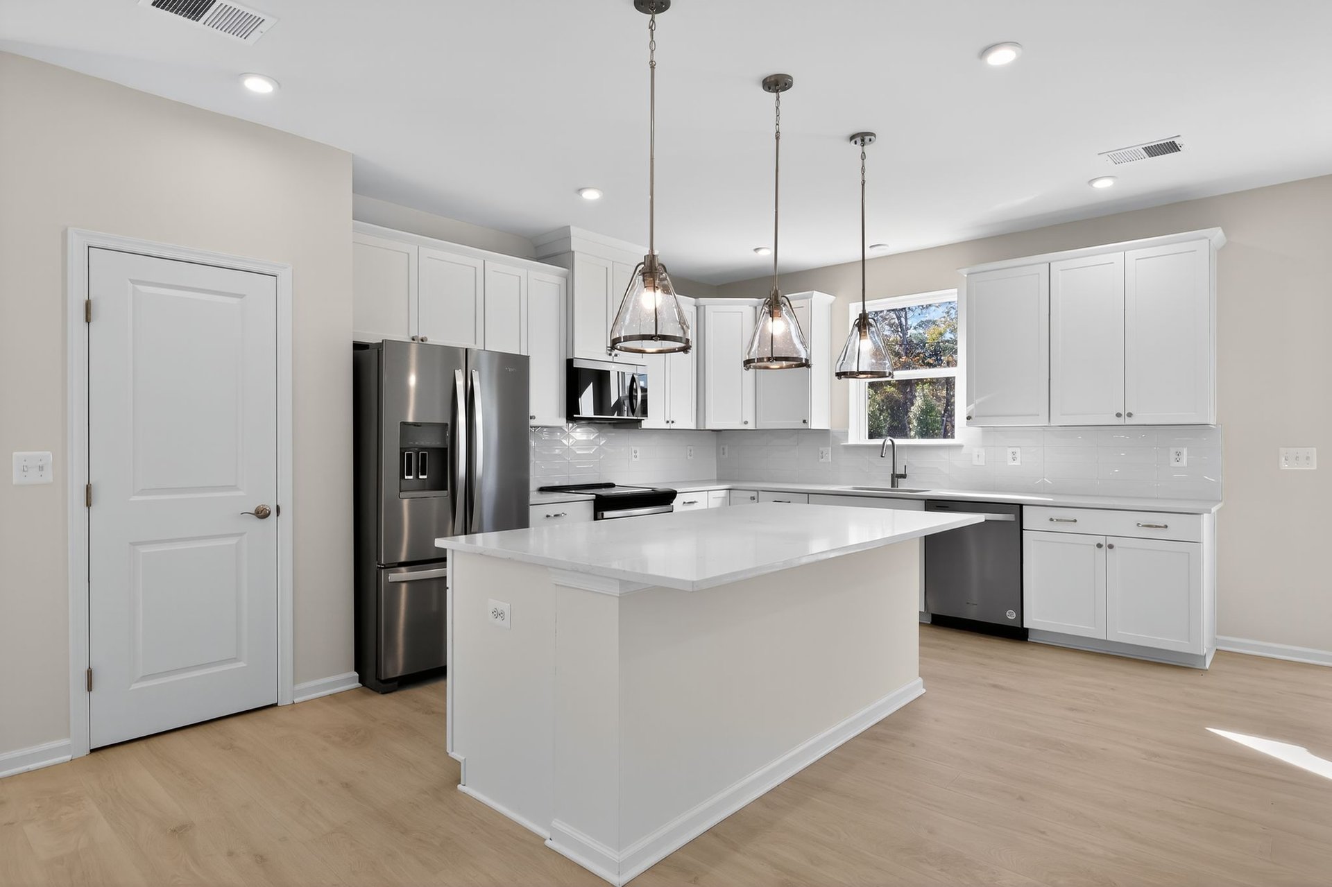 kitchen with white cabinets and a center island