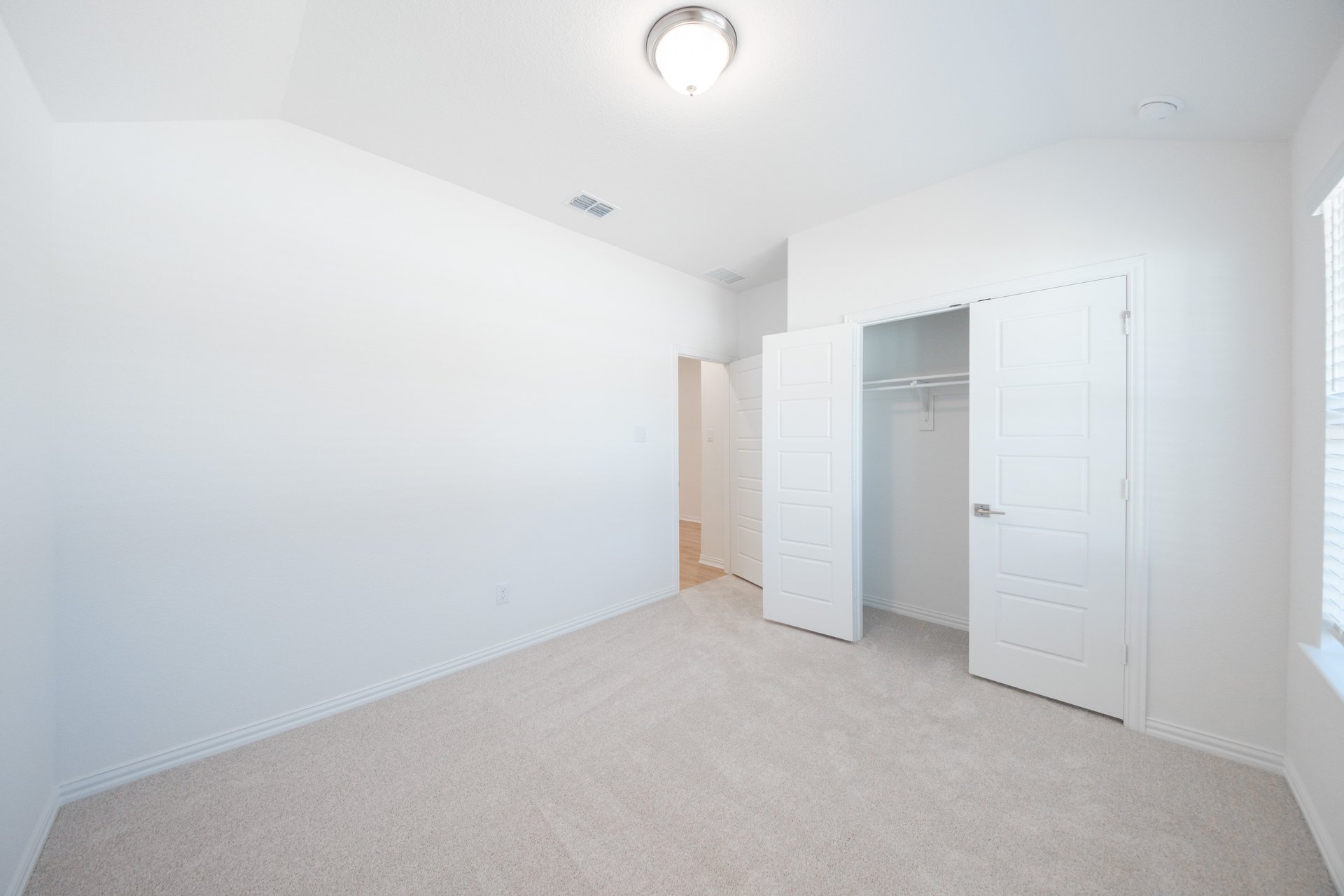 guest bedroom with carpet