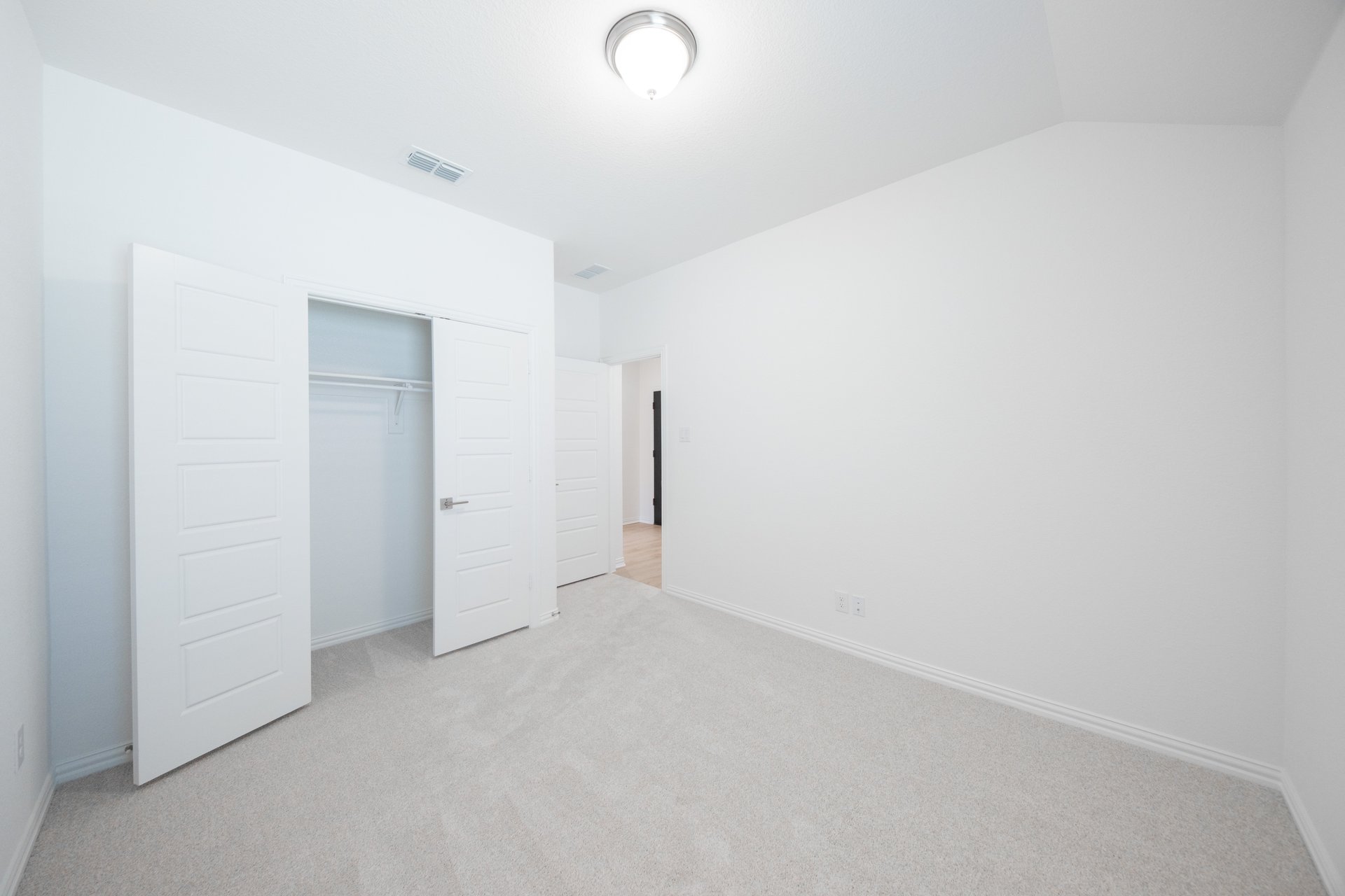 guest bedroom with carpet
